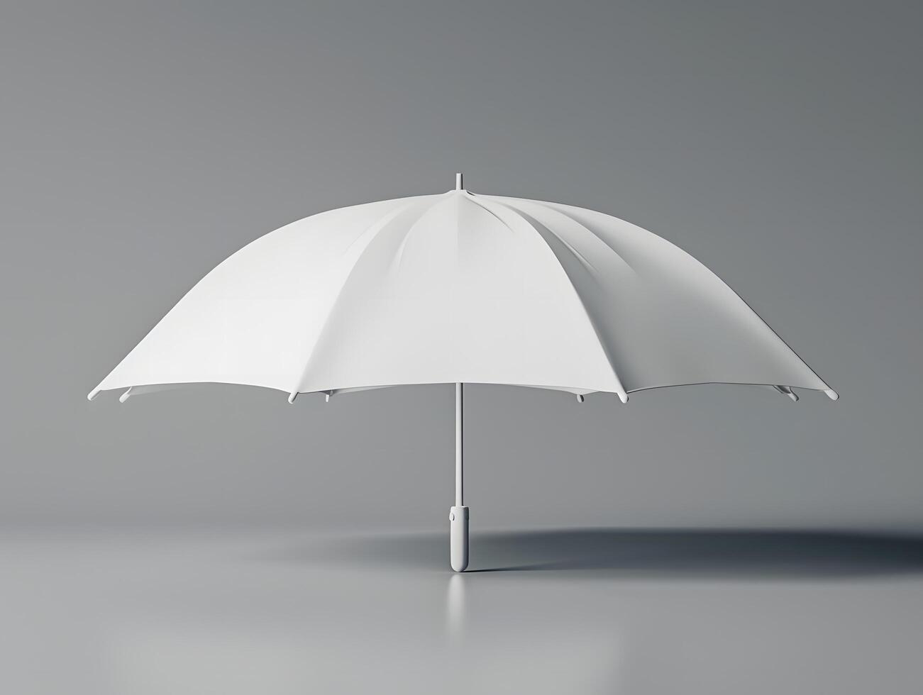 An umbrella is shown on a gray surface photo
