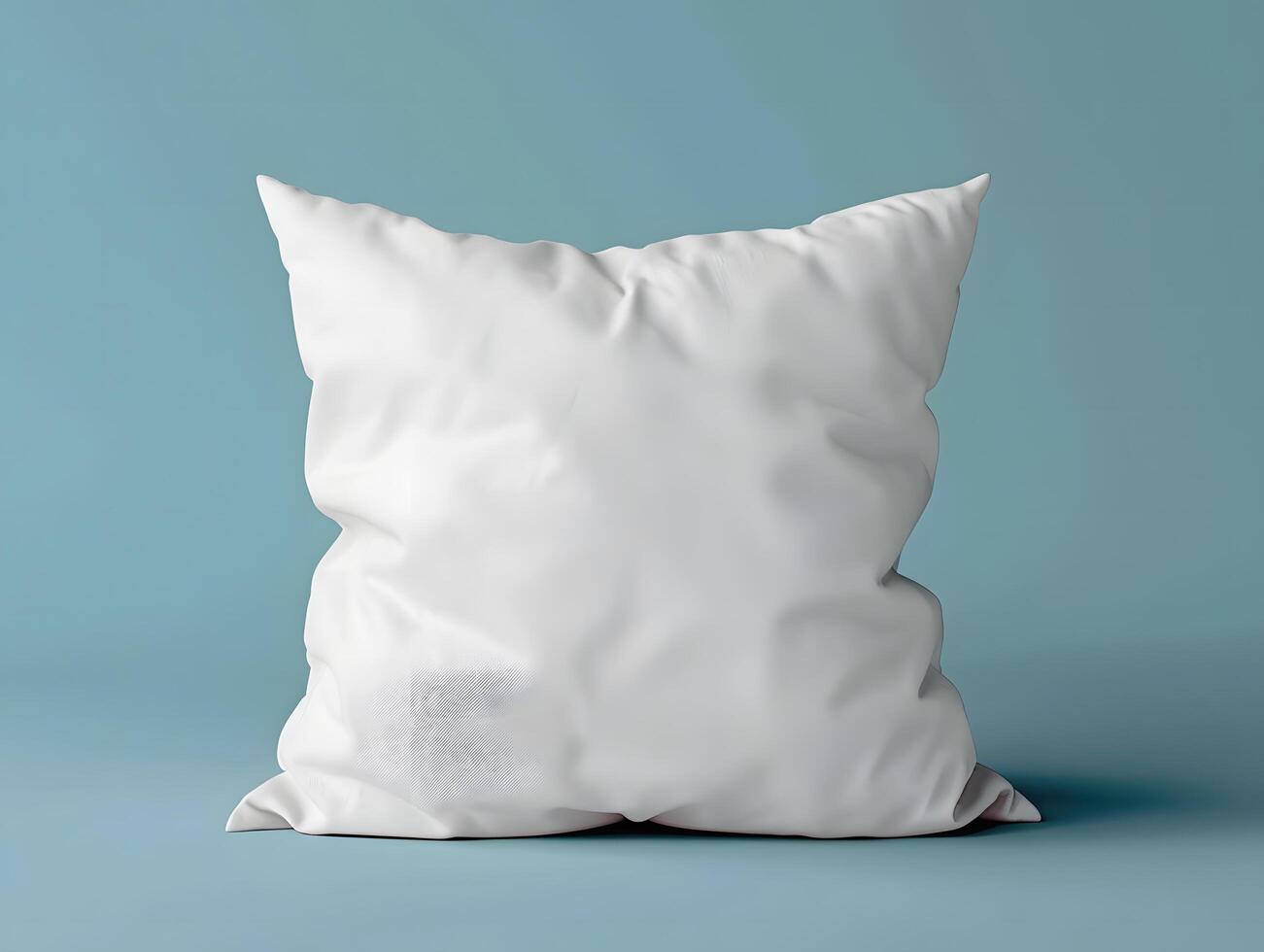 A white pillow on a blue background photo