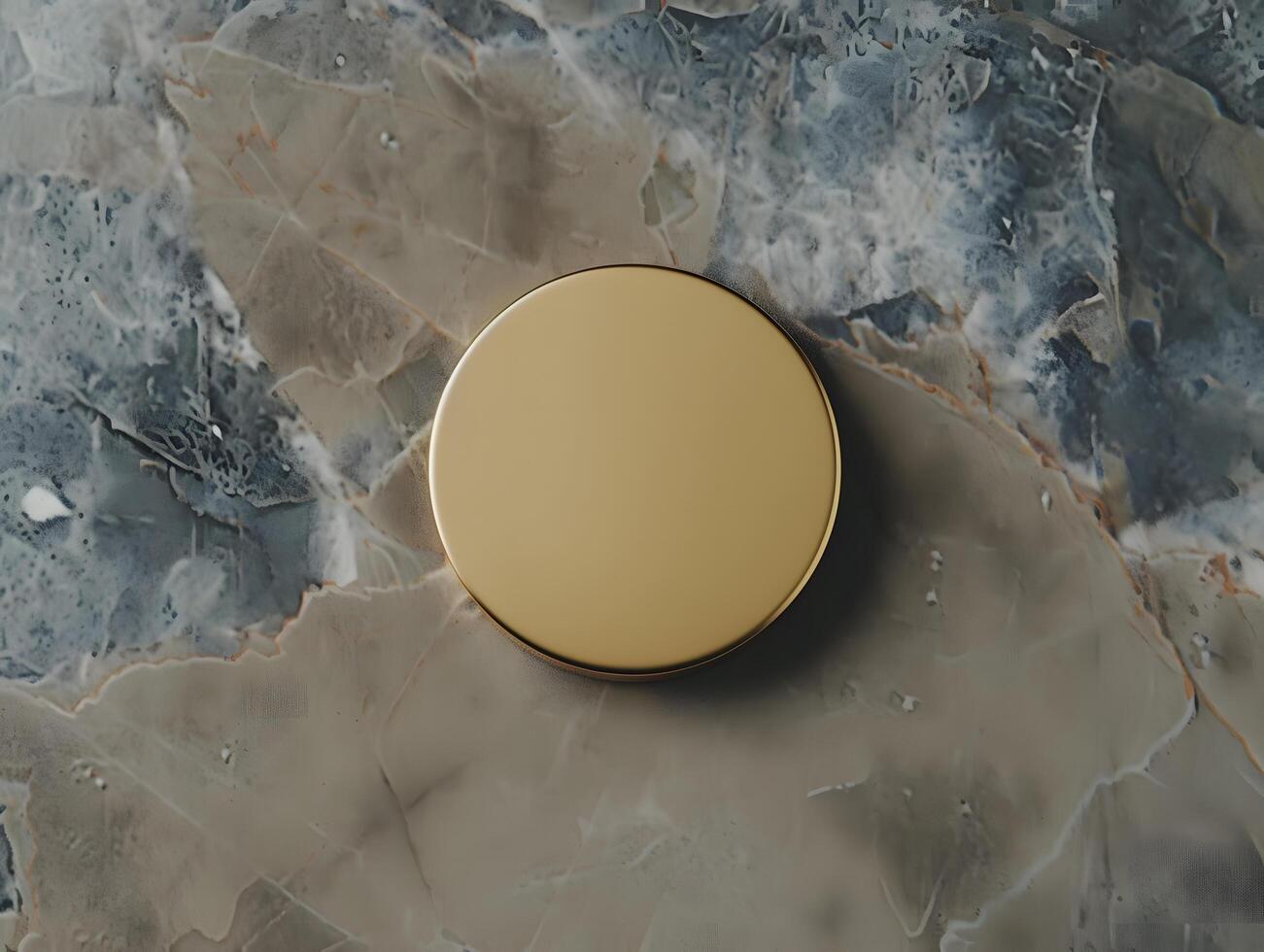 A gold round object on a marble surface photo