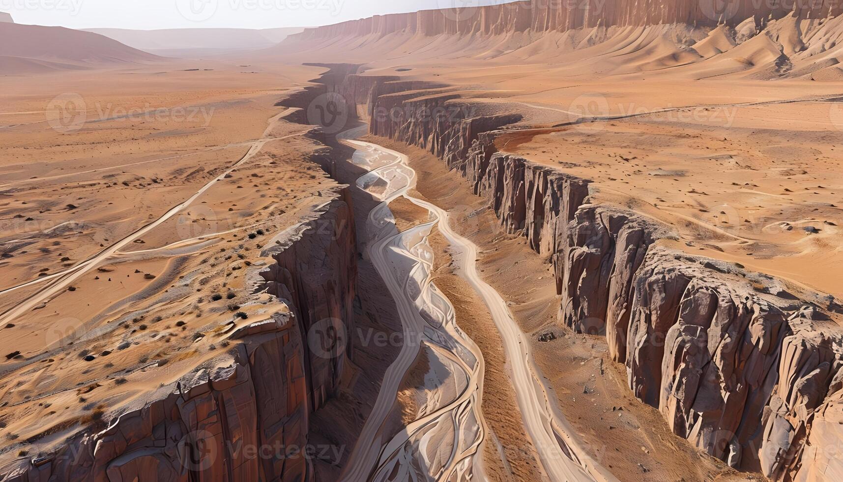 A canyon in the desert with a river running through it photo