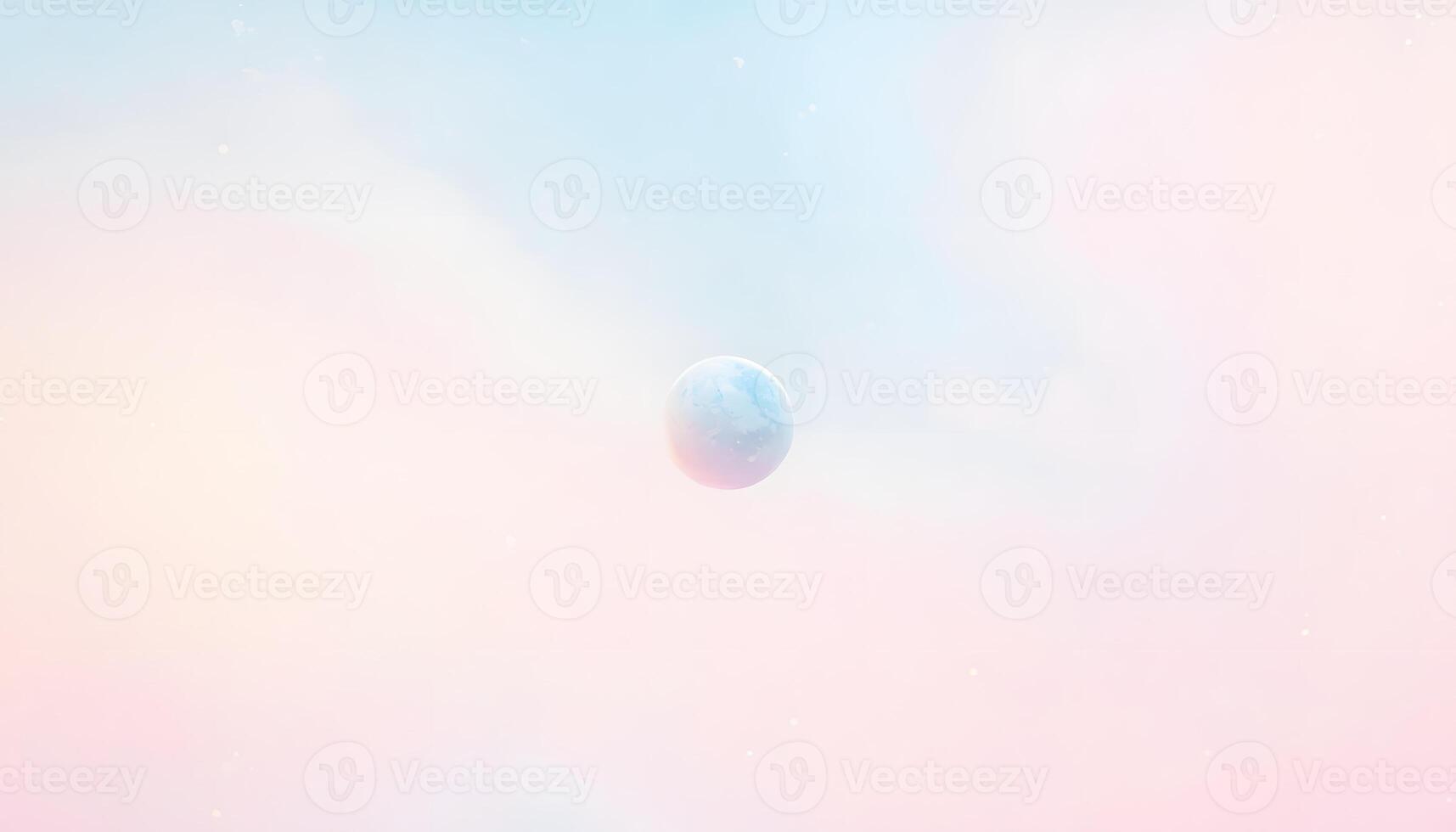 A blue ball floating in the air in a pink and blue sky photo