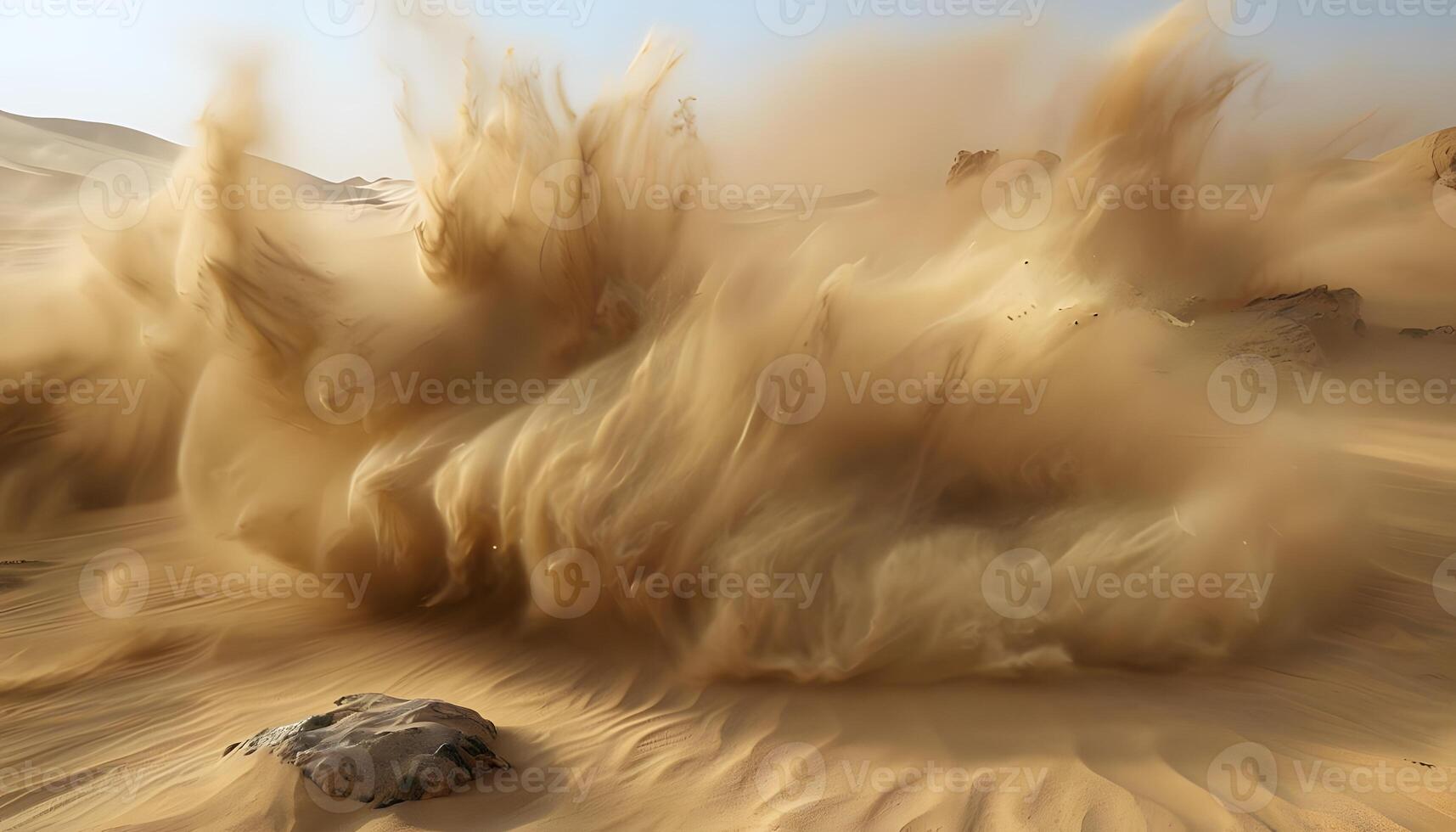 A sand storm is blowing in the desert photo