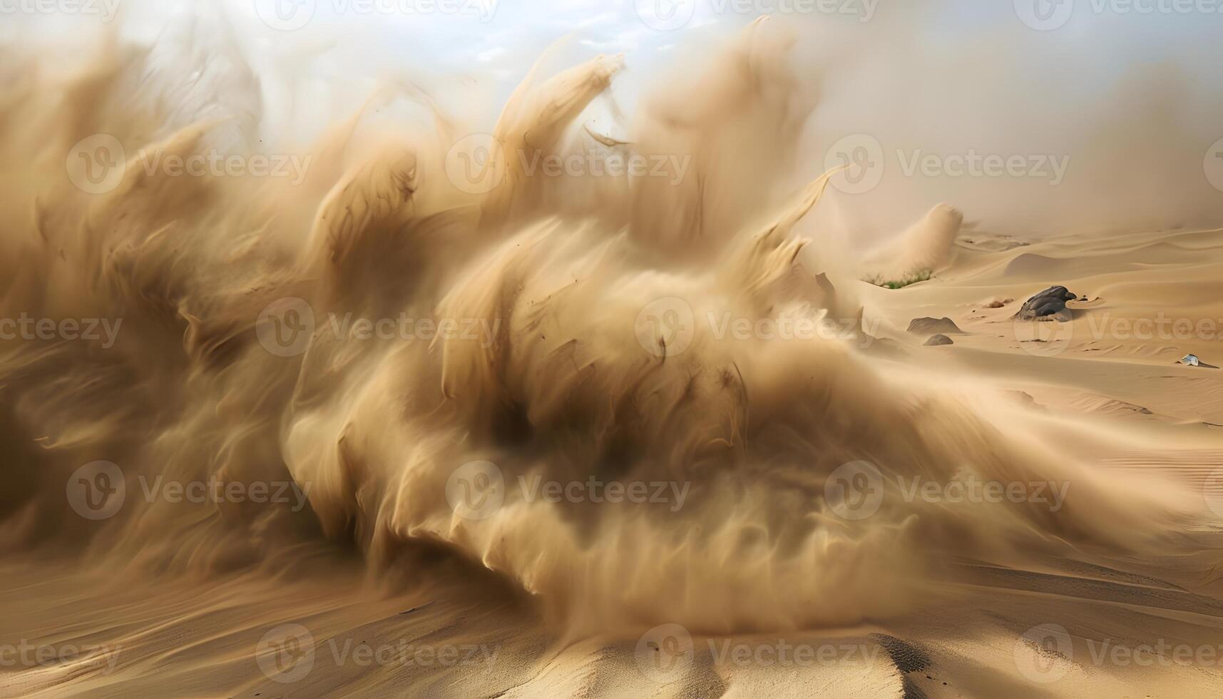 A sand storm is blowing in the desert photo