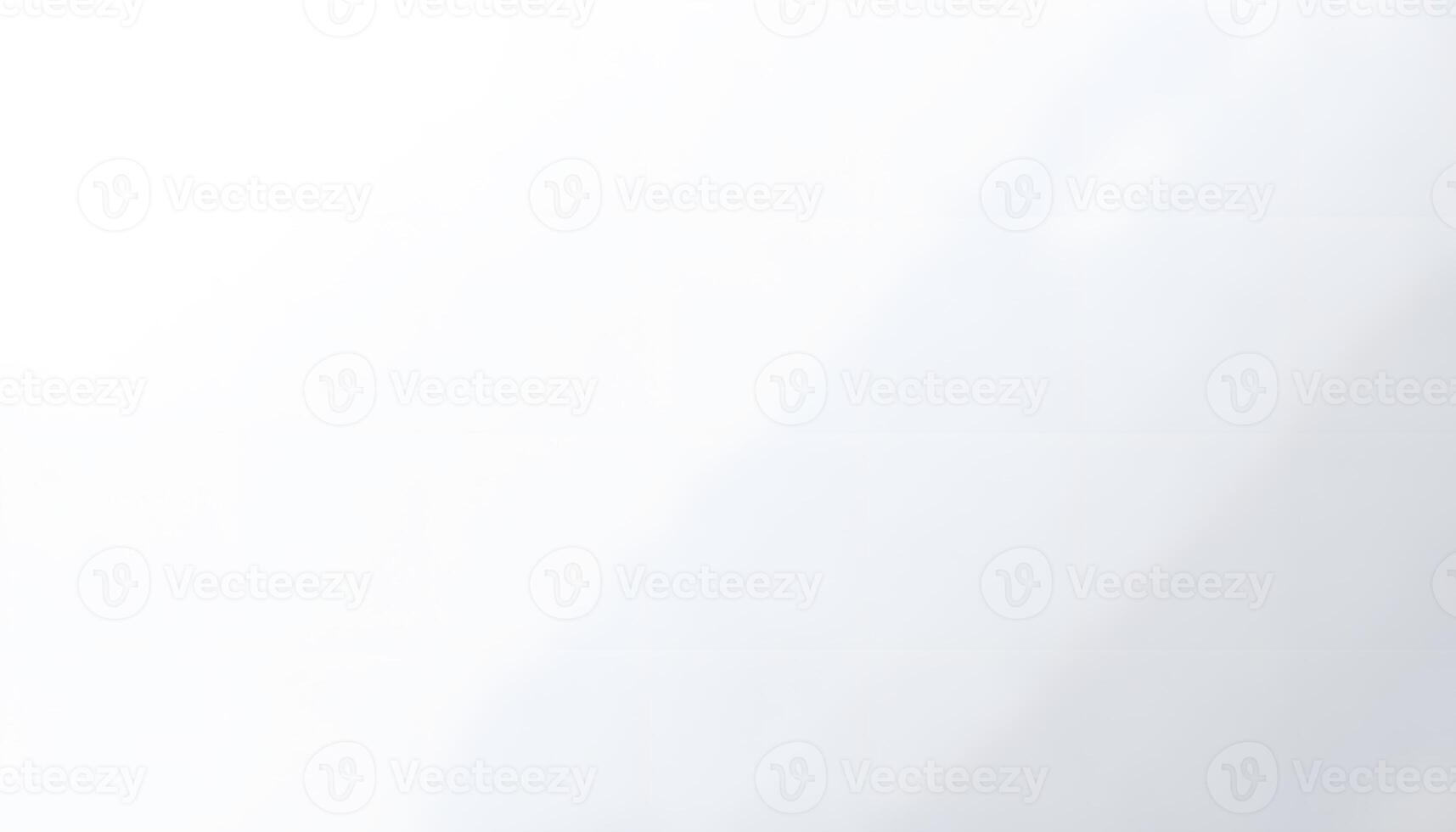 A man is standing in front of a white wall photo