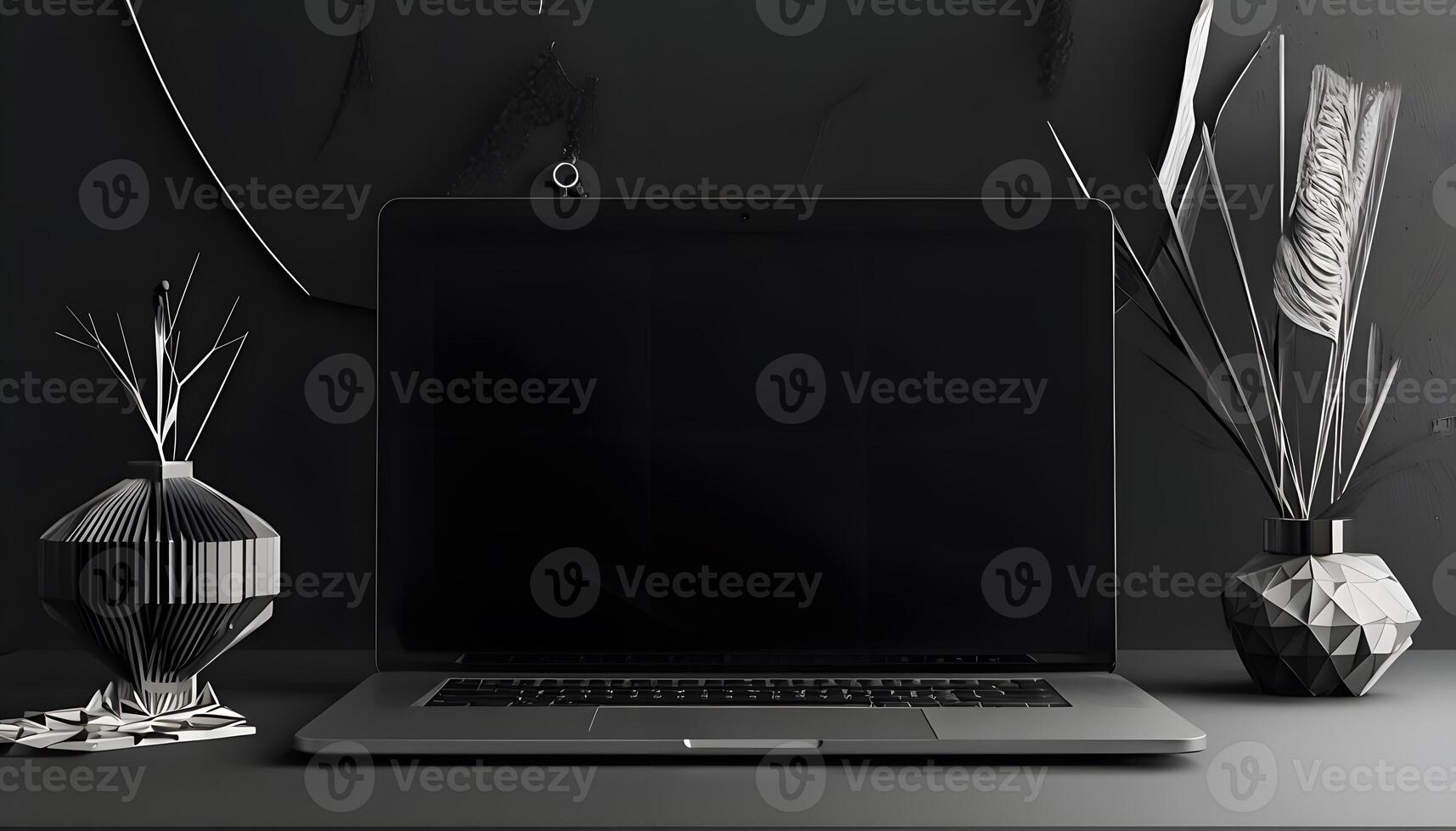 A black laptop sitting on a desk next to a vase photo