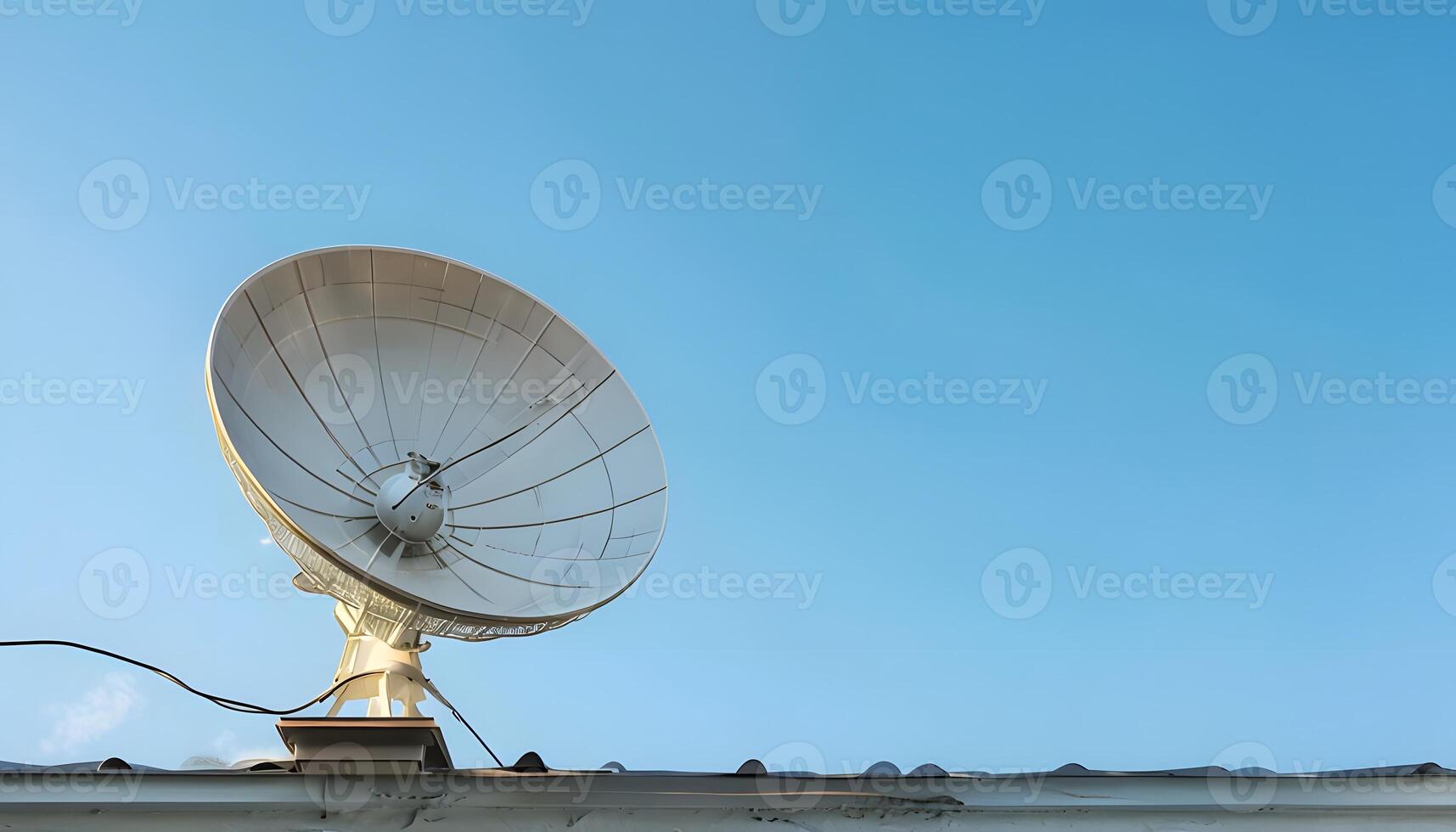 A satellite dish on top of a roof photo
