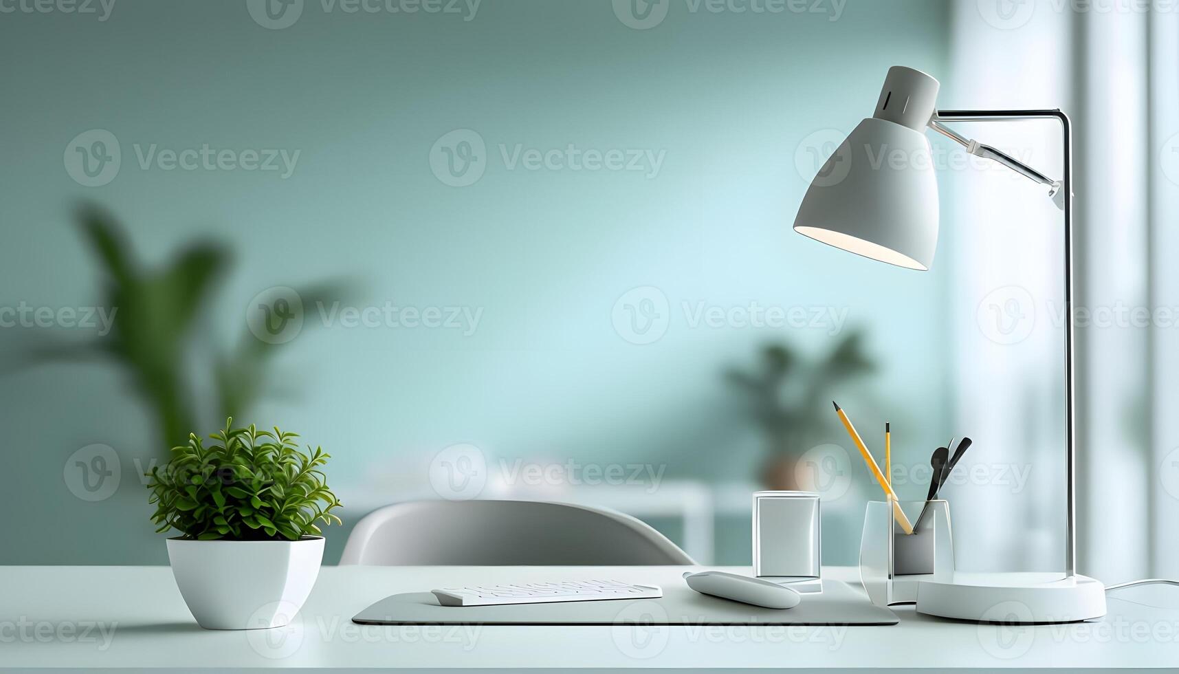 A desk with a lamp, a plant and a cup of coffee photo