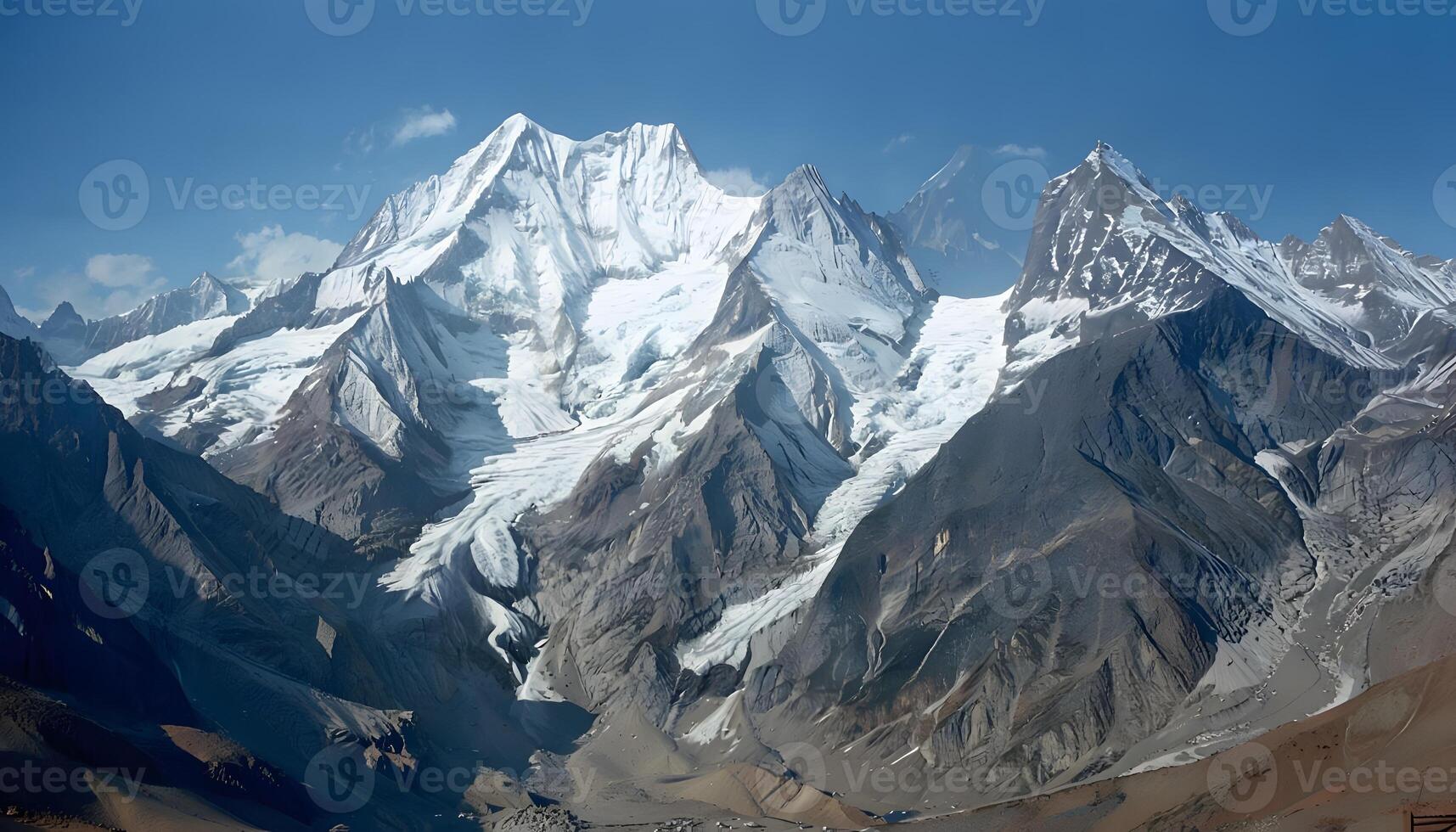 A large mountain range with snow capped peaks photo