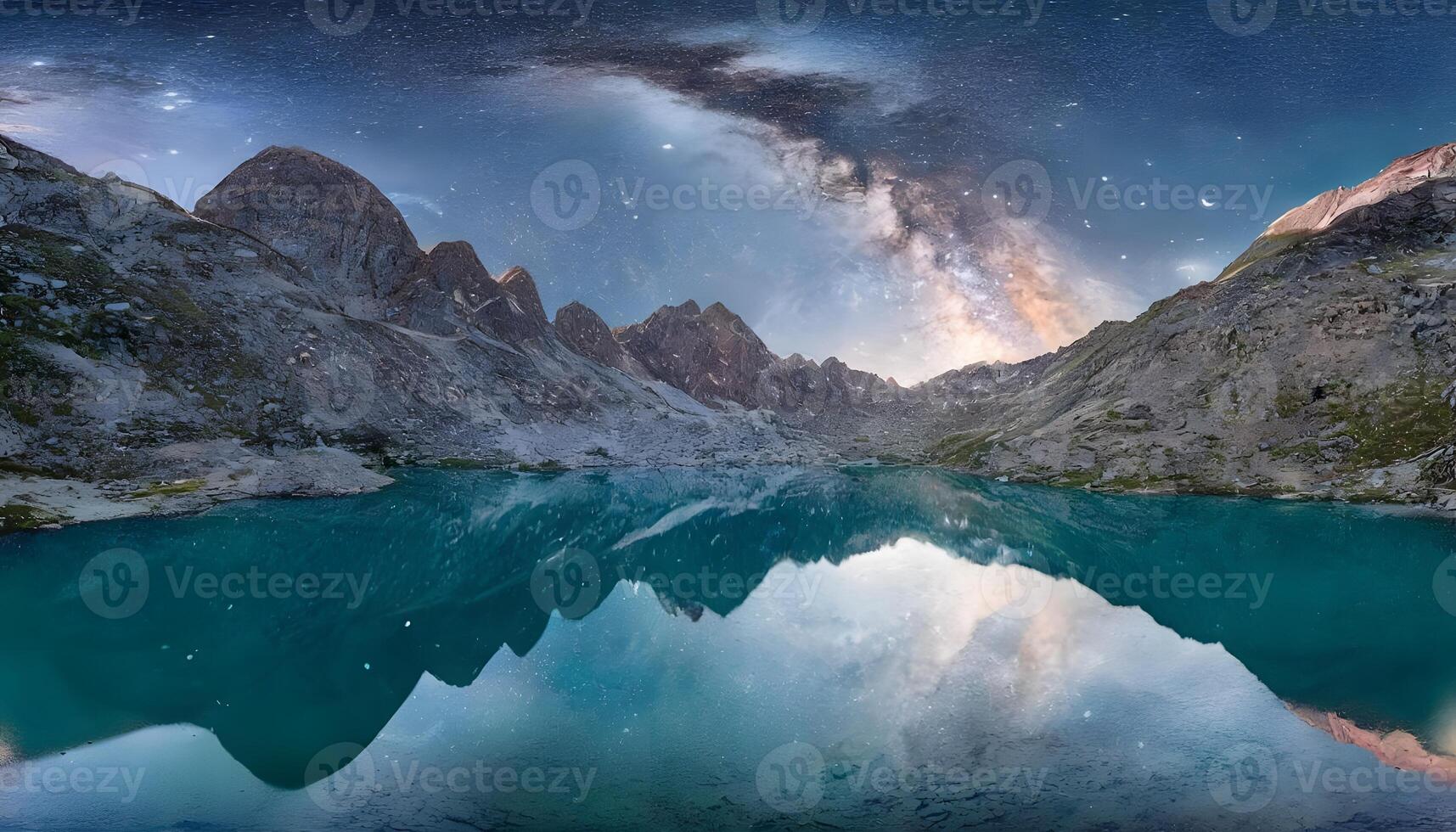 The milky way over a mountain lake with mountains in the background photo