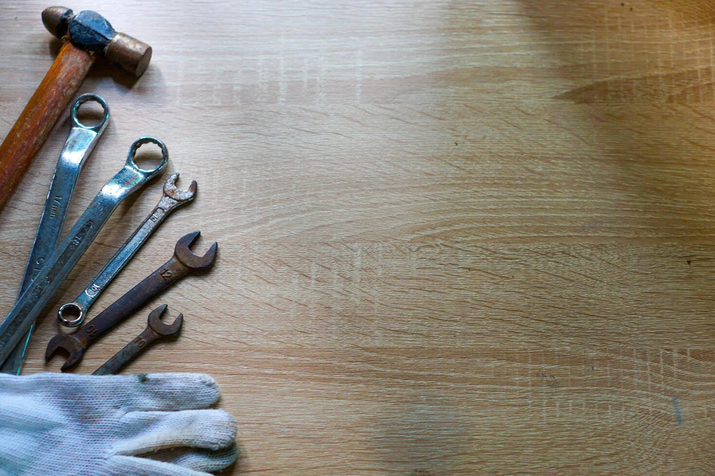 a wooden table with a variety of tools on it photo
