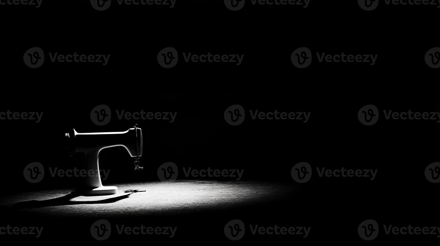 Classic sewing machine with dramatic spotlight effect photo