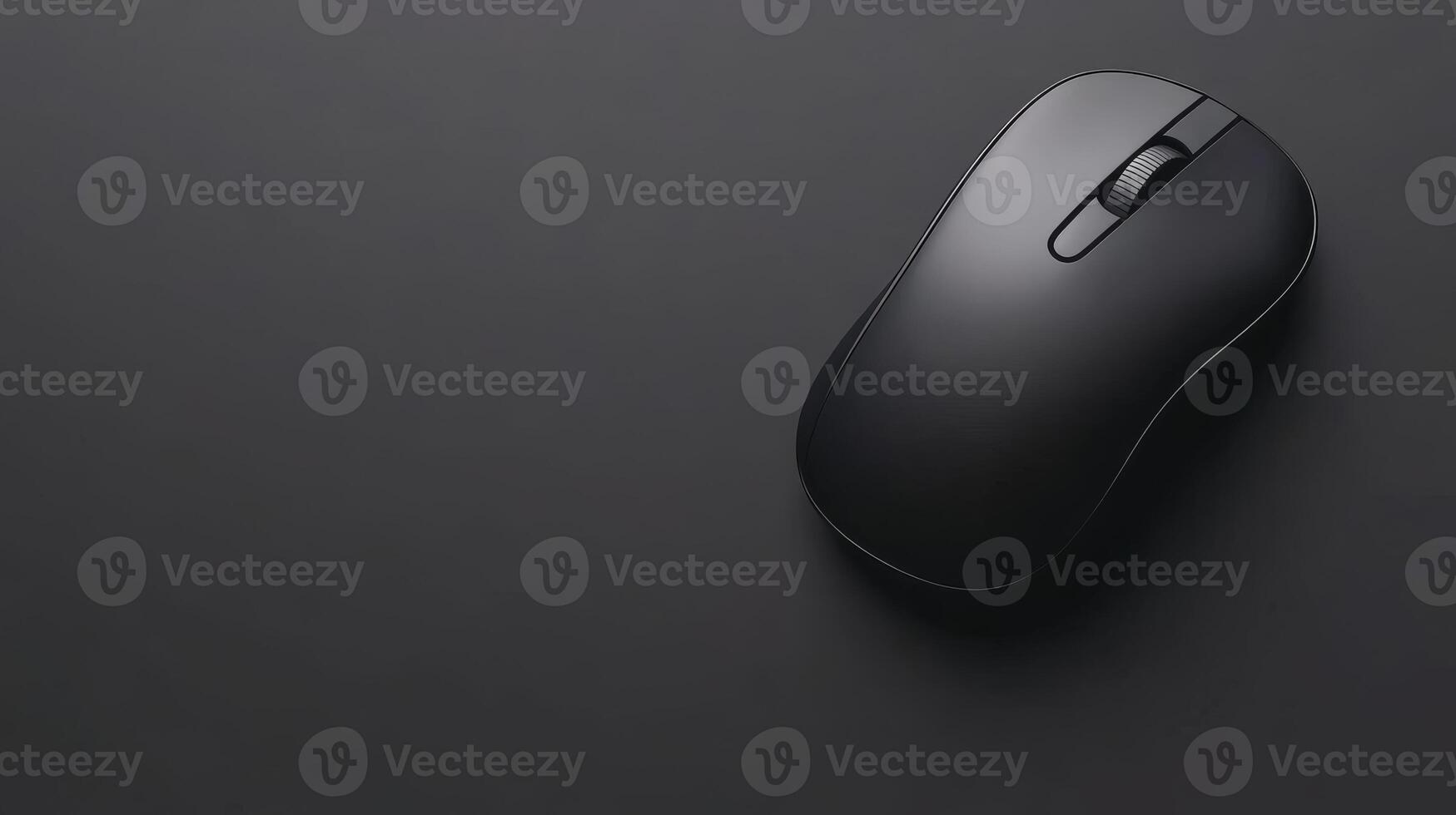 Wireless mouse lying on black surface photo