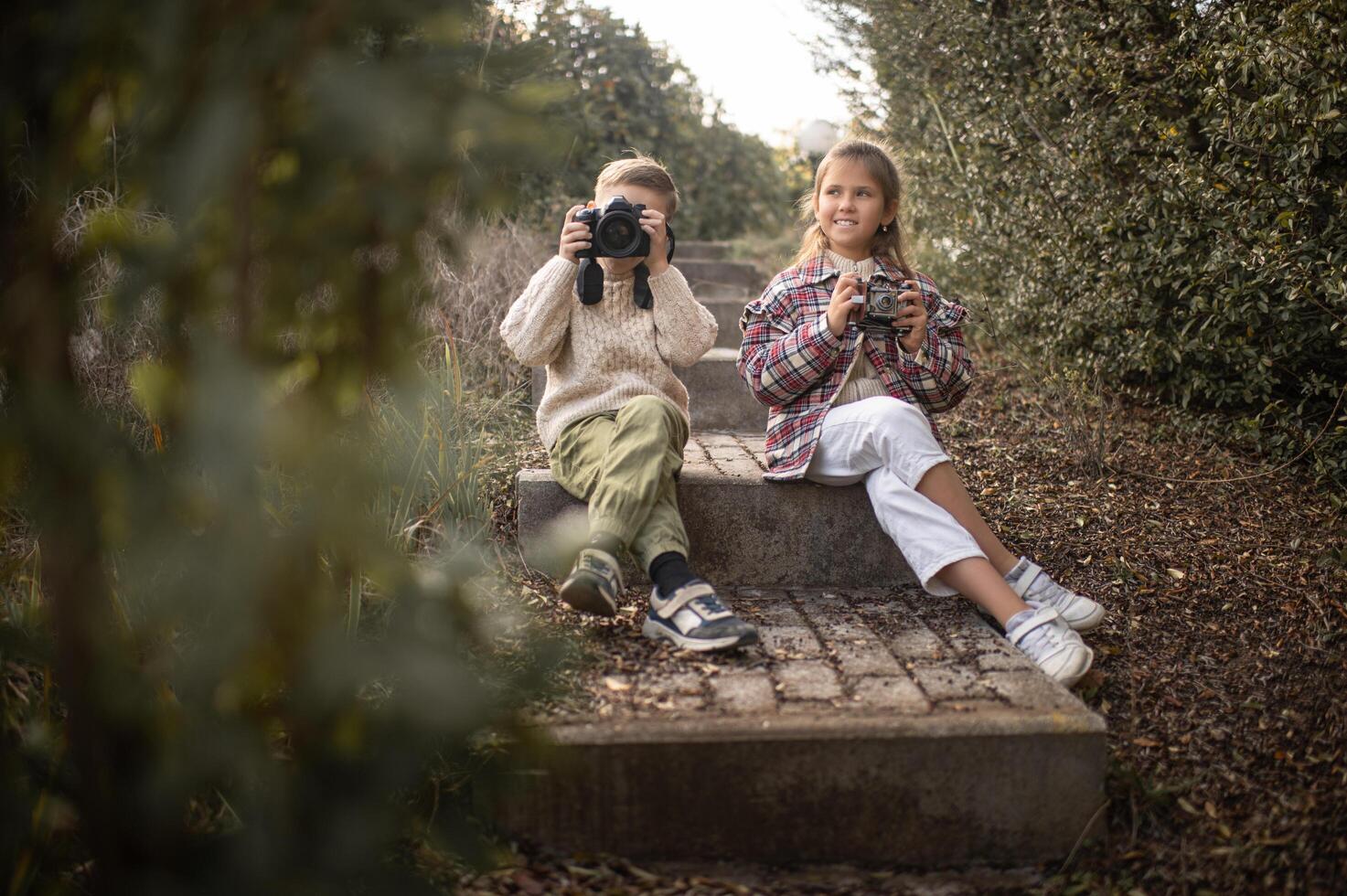 The old stone steps become their studio as Childs frame the world through their lenses, lost in creativity. photo