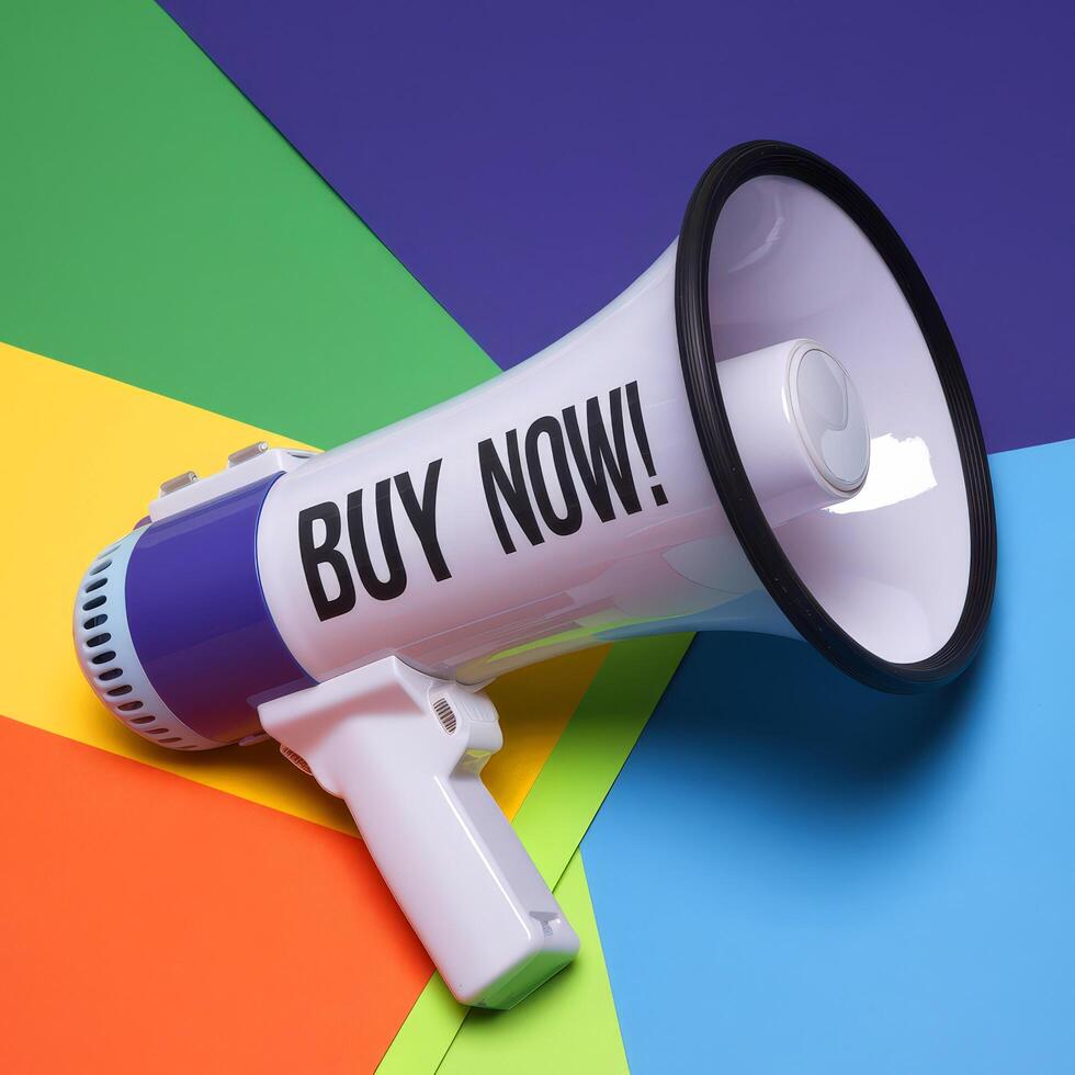 Megaphone with BUY NOW message on colorful background. sale discount photo