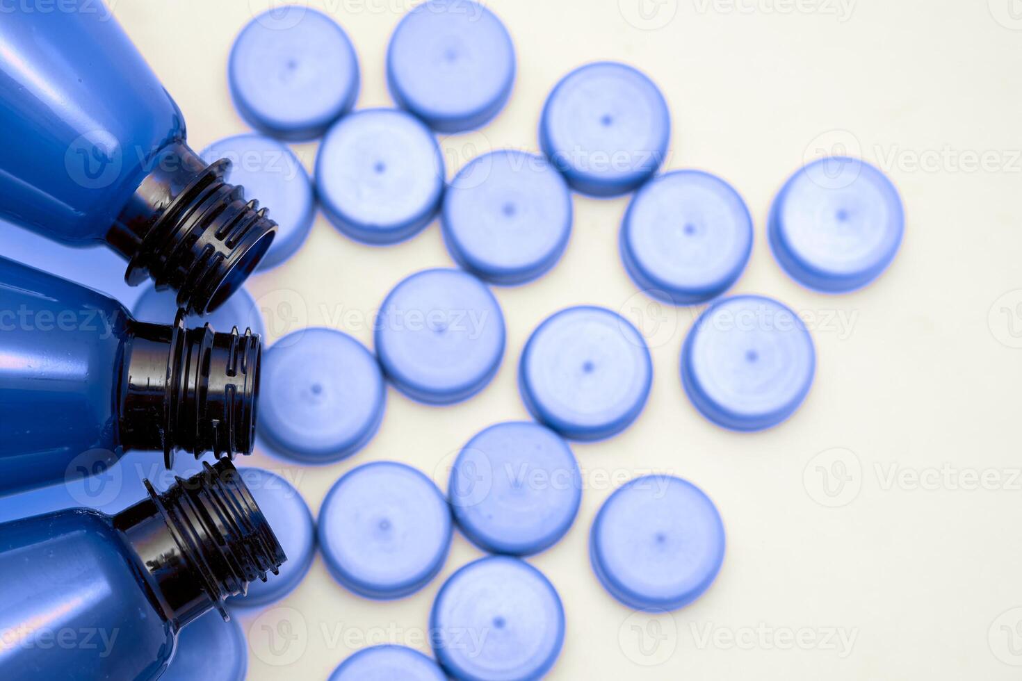 Blue plastic various bottles with corks for detergents,beer,soda,lemonade photo