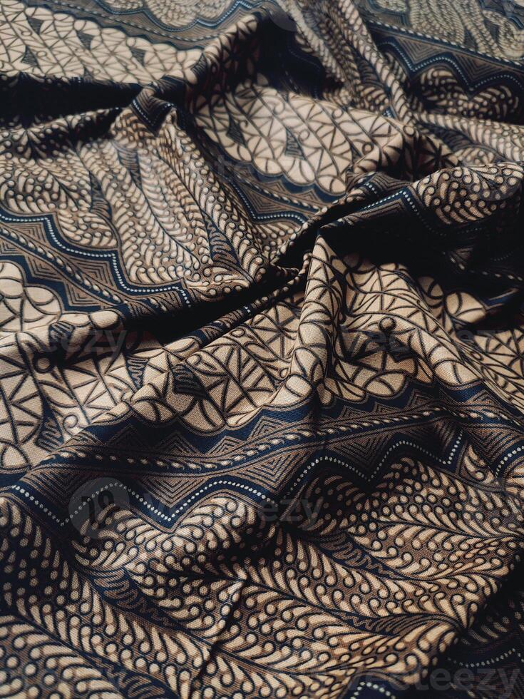 a close up of black and brown pattern fabric photo