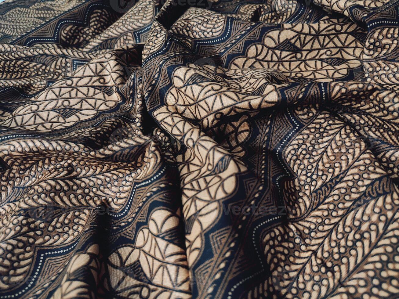 Black and gold patterned fabric with a pattern photo