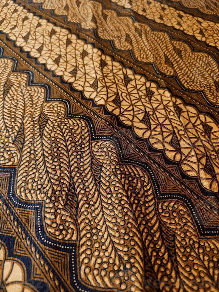 a close up of a black and brown pattern fabric photo