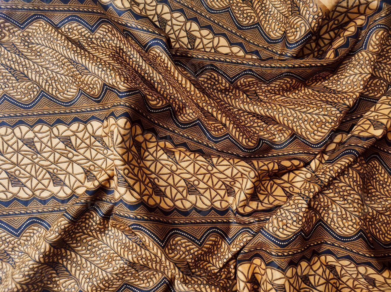 a close up of a brown and black fabric with a pattern photo