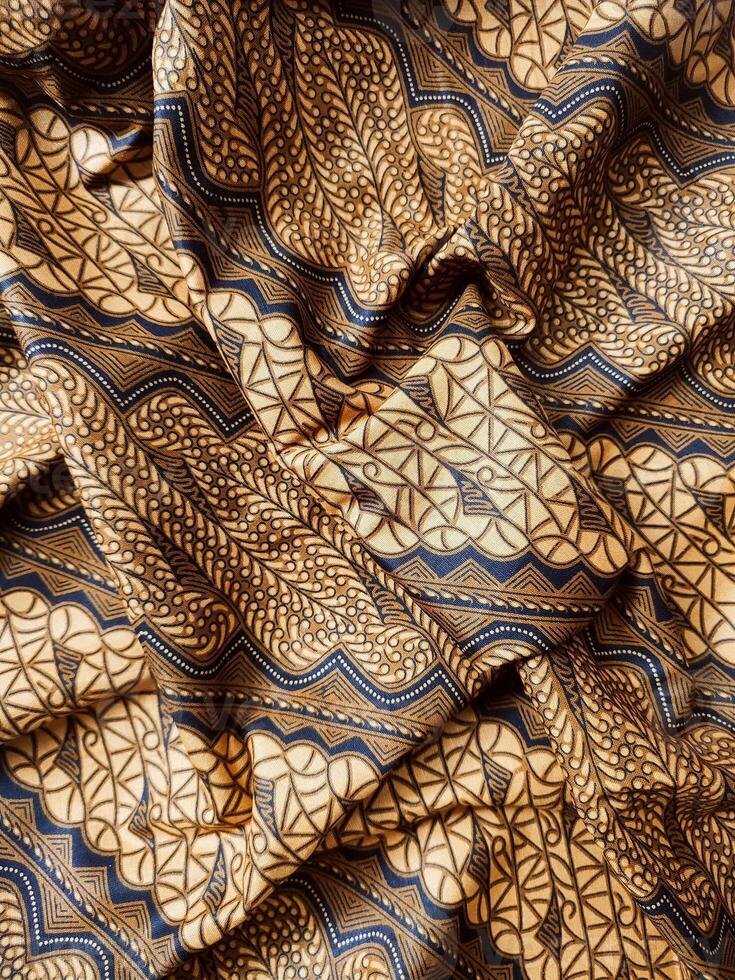 close up of a brown and blue patterned fabric photo