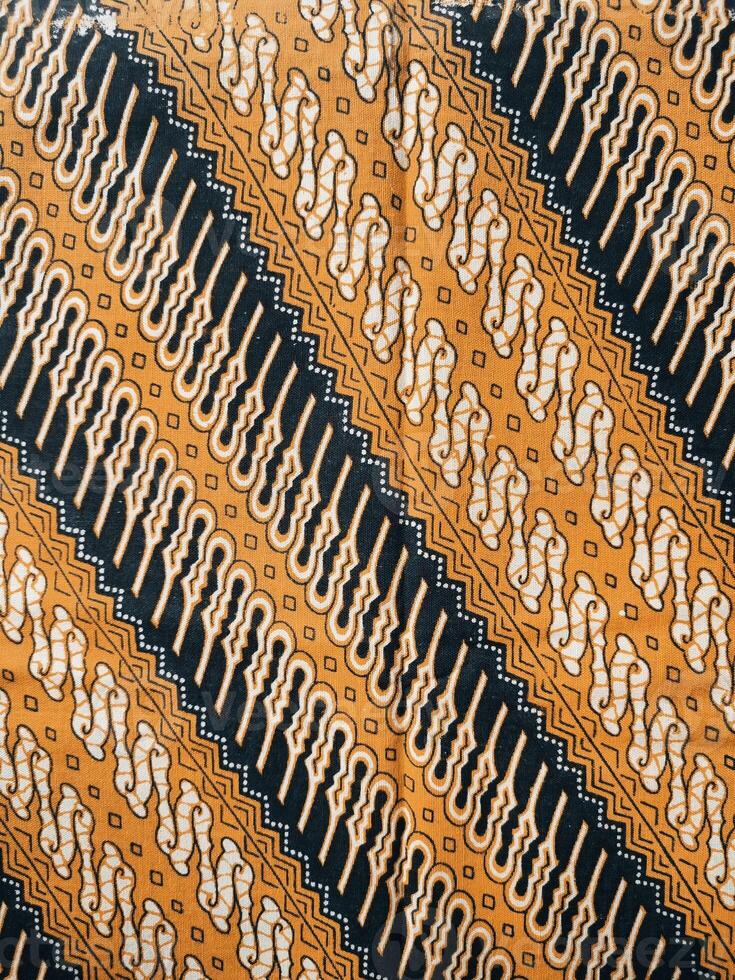 a close up of a black and yellow fabric with a pattern photo