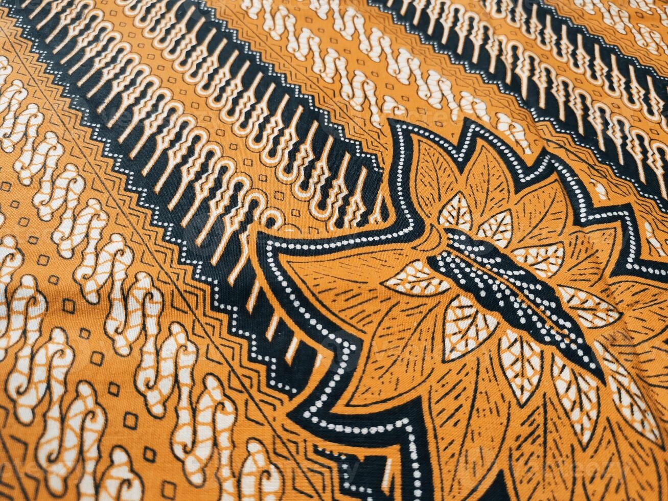 Batik Parang Yogyakarta, in various modern patterns and colors, this Indonesian batik with flora motifs and traditional geometric pattern photo