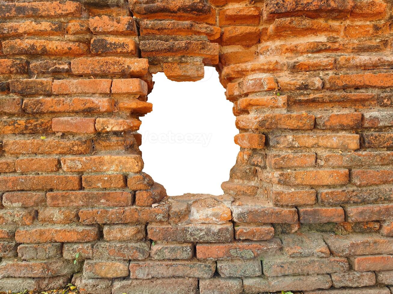 Hole in the ancient brick wall, ancient red brick texture. photo