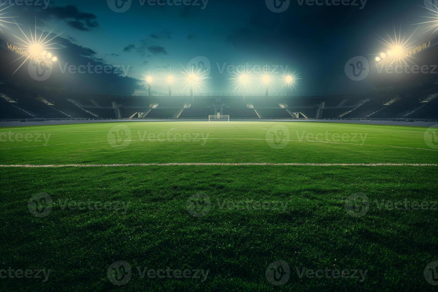 A soccer field with a large crowd of people watching the game photo