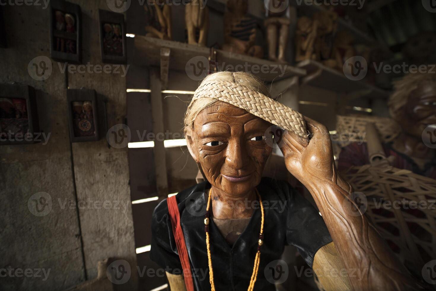 Souvenirs Women's wood sculptures are better known as Tao Tao among indigenous cultures of Tana Toraja in Sulawesi photo