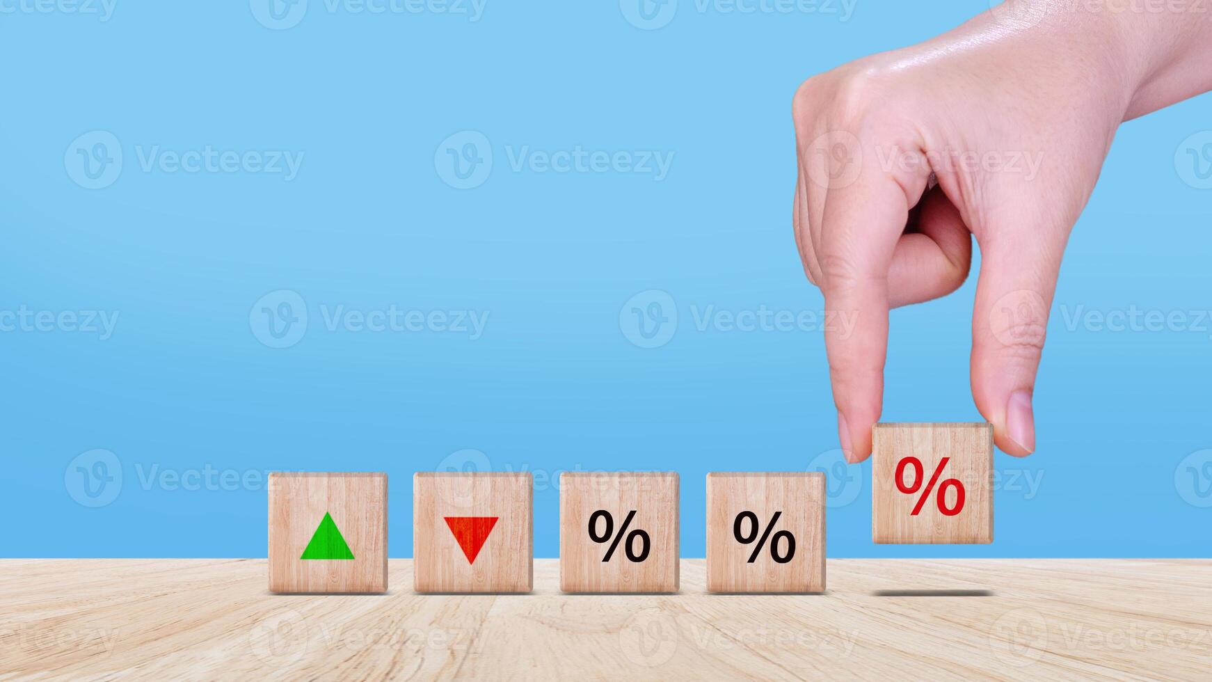 Financial, stocks, interest rate and GDP percent change, wooden block with percentage sign and arrow up sign and down for interest rate, ranking, percentage sign photo