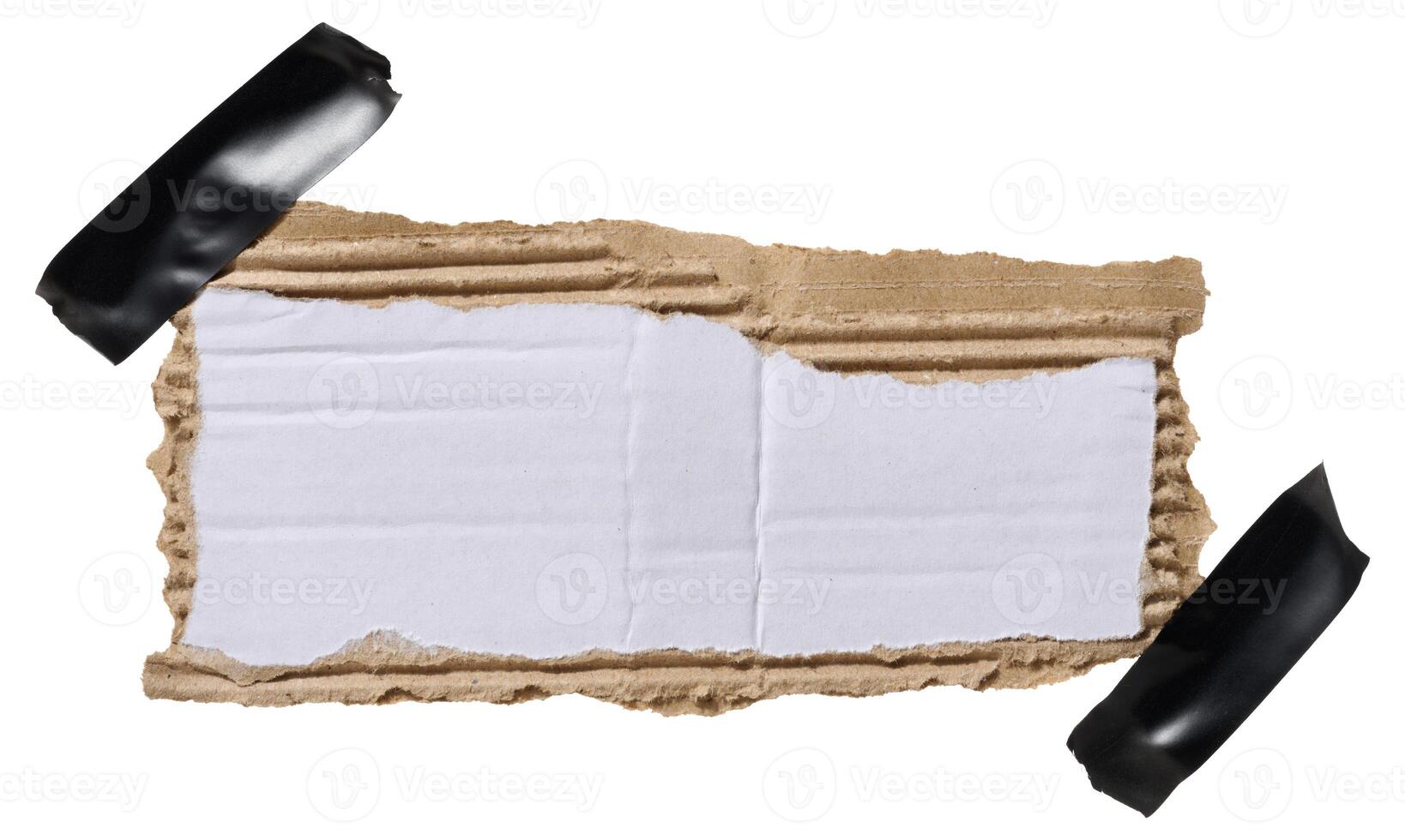 Torn piece of white corrugated cardboard attached to black piece of electrical tape, isolated background, copy photo