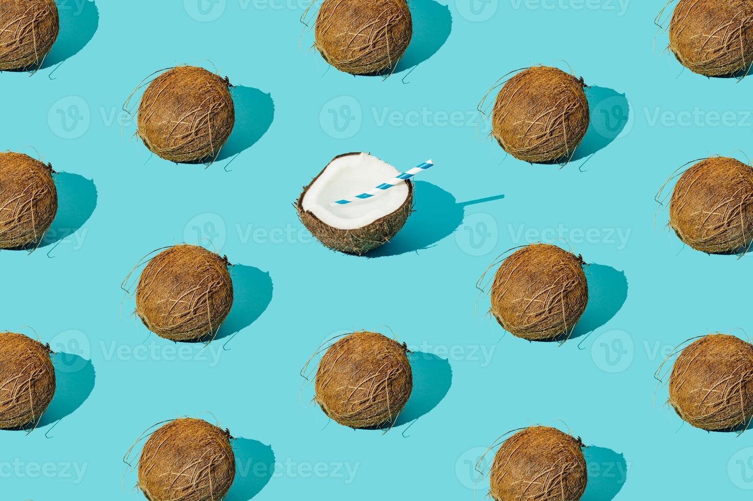 Fruit pattern made of coconuts on light pastel blue background. Minimal tropical beach concept. Nature summer composition. Trendy summertime party idea. Coconut aesthetic. Creative food backdrop. photo
