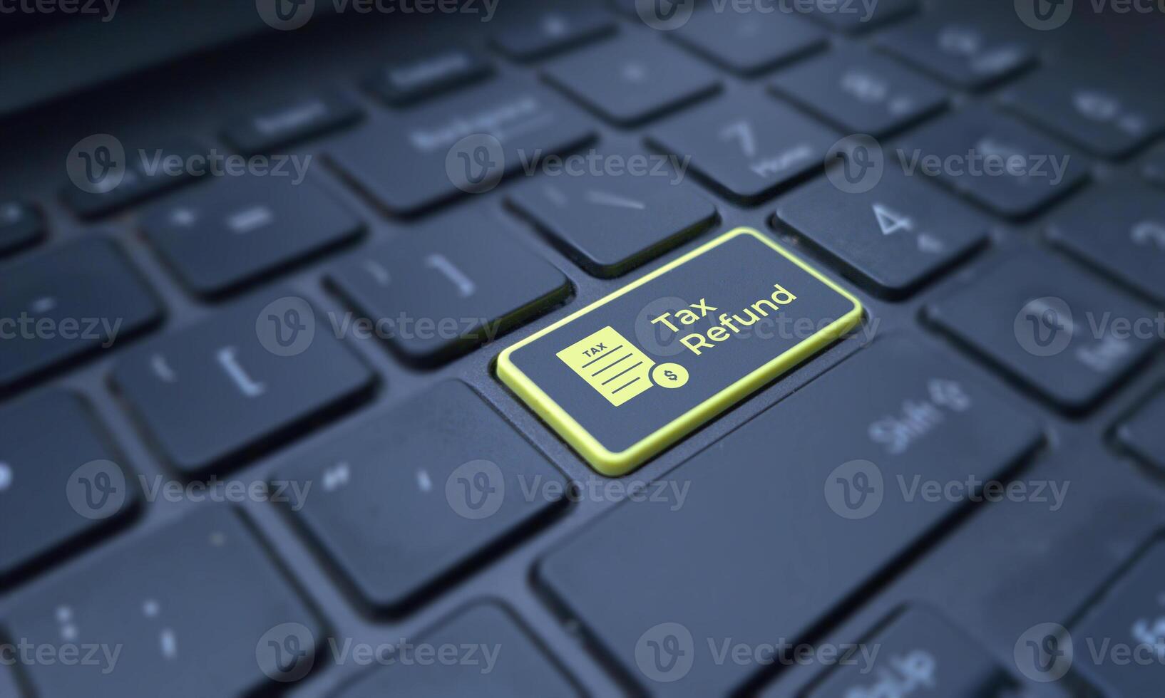 Tax refund concept on a highlighted keyboard key. Business and finance photo