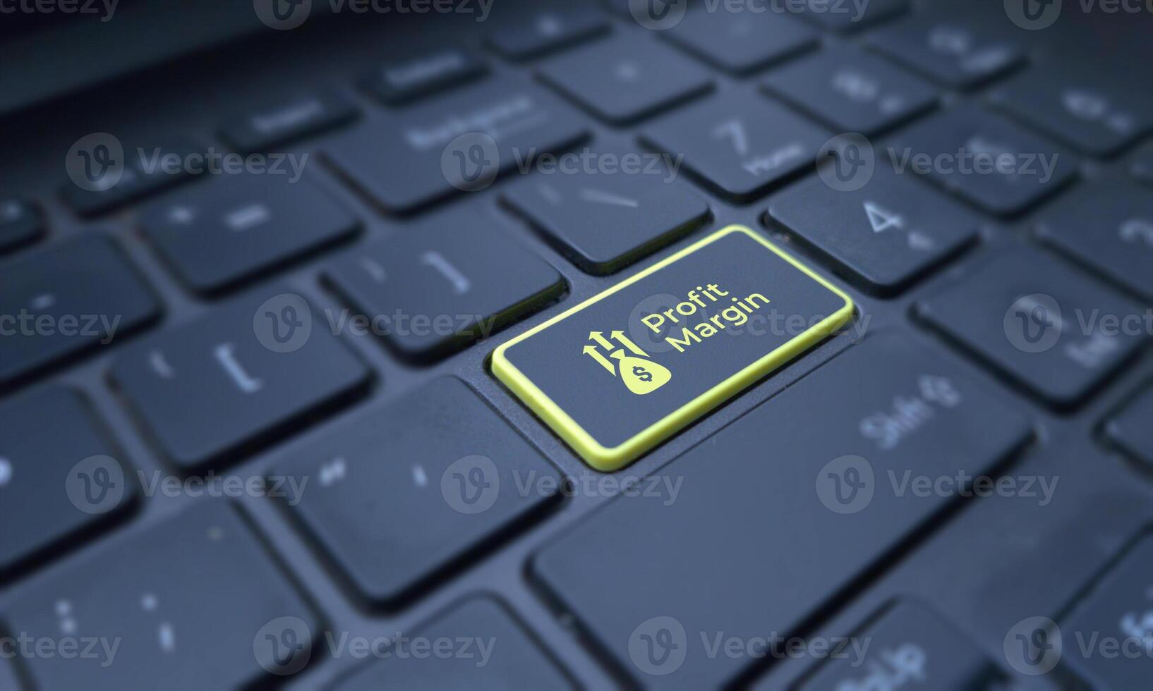 Profit margin concept on a highlighted keyboard key. Business and finance photo