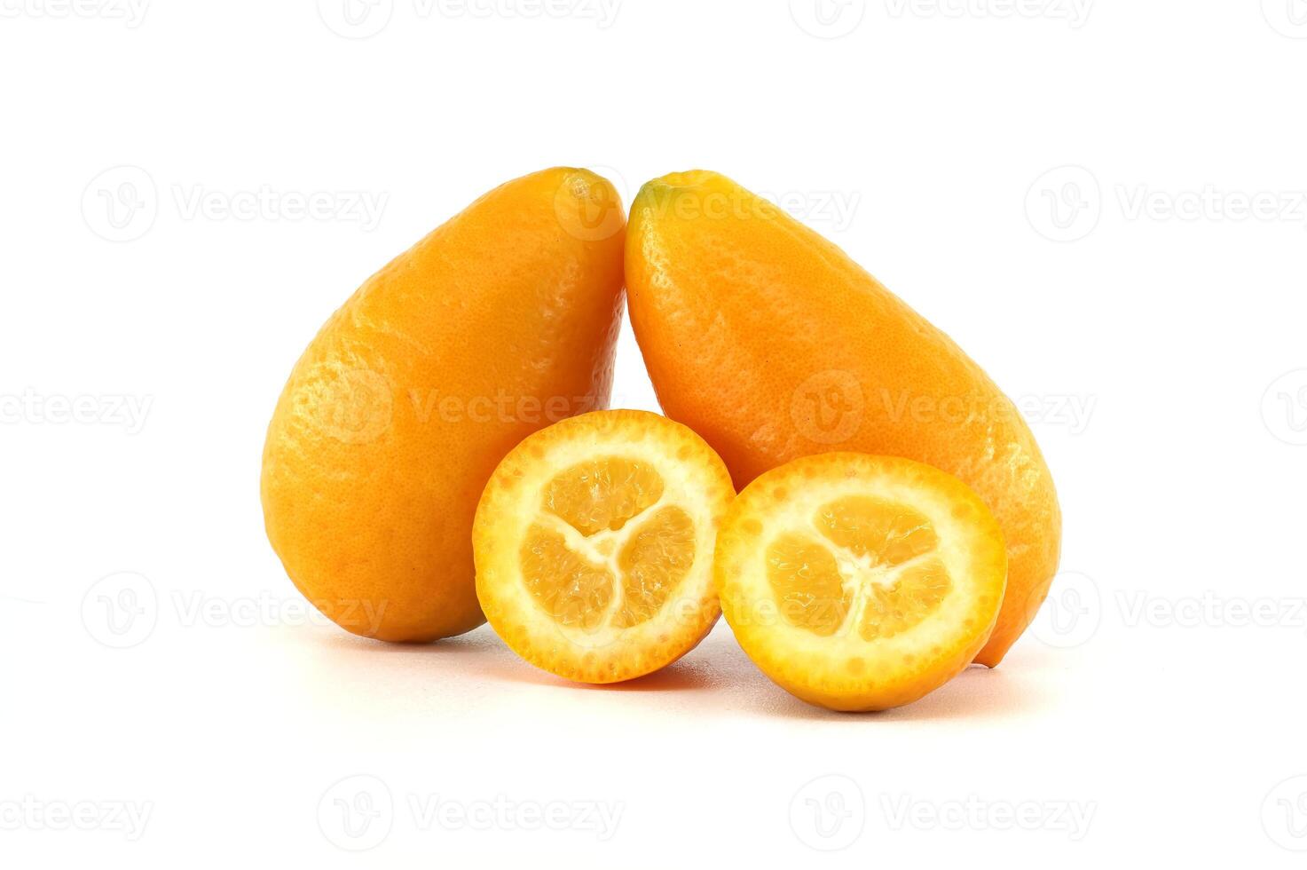 Two kumquats and two halves showing the pulp on a white background photo