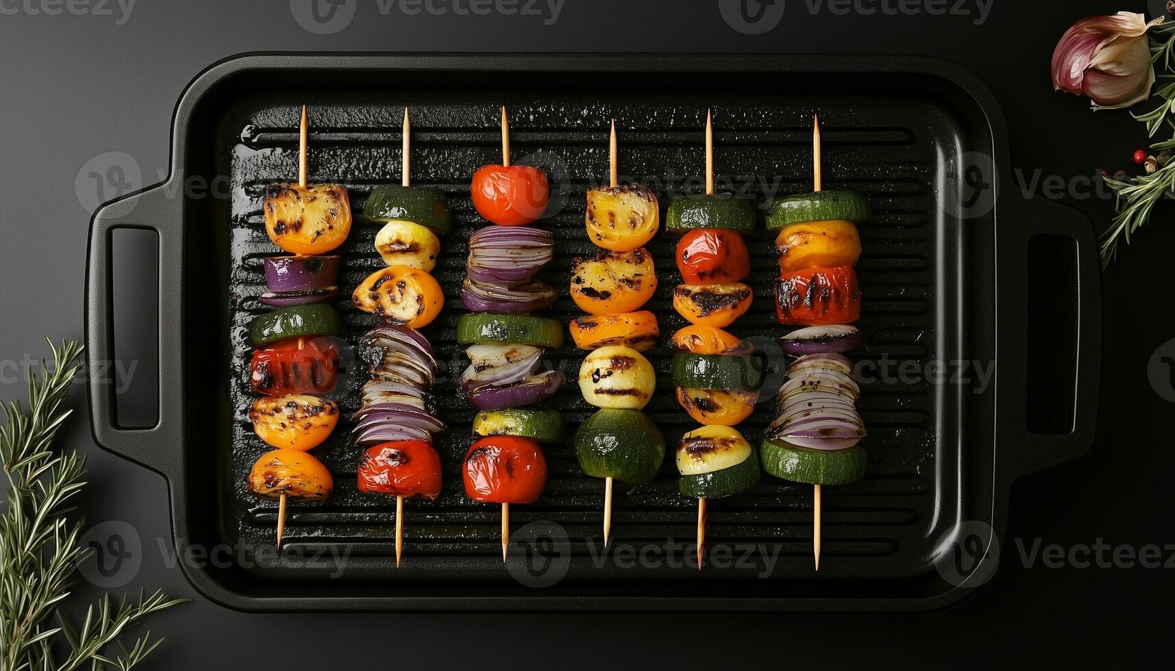 Vegetable slice skewer grill on black pan for healthy dinner at home photo