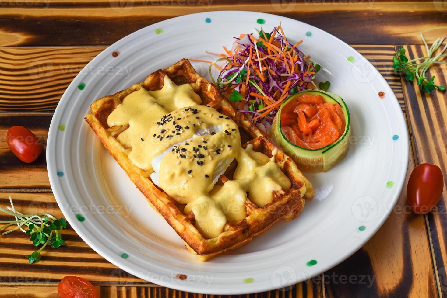 Eggs Benedict poached egg on belgian waffles with salted salmon photo