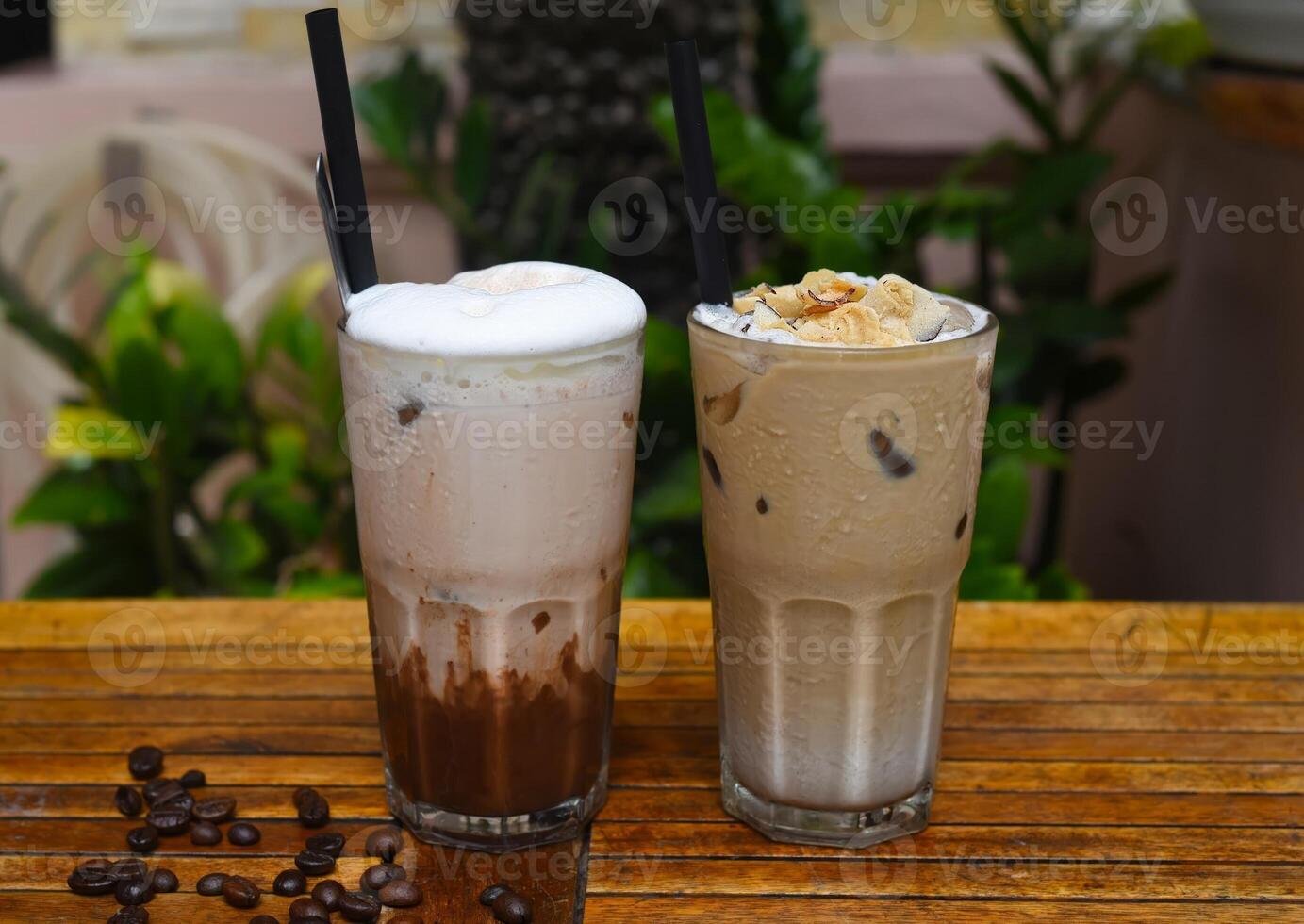 Coffee beverages on the wooden table with coffee beans photo