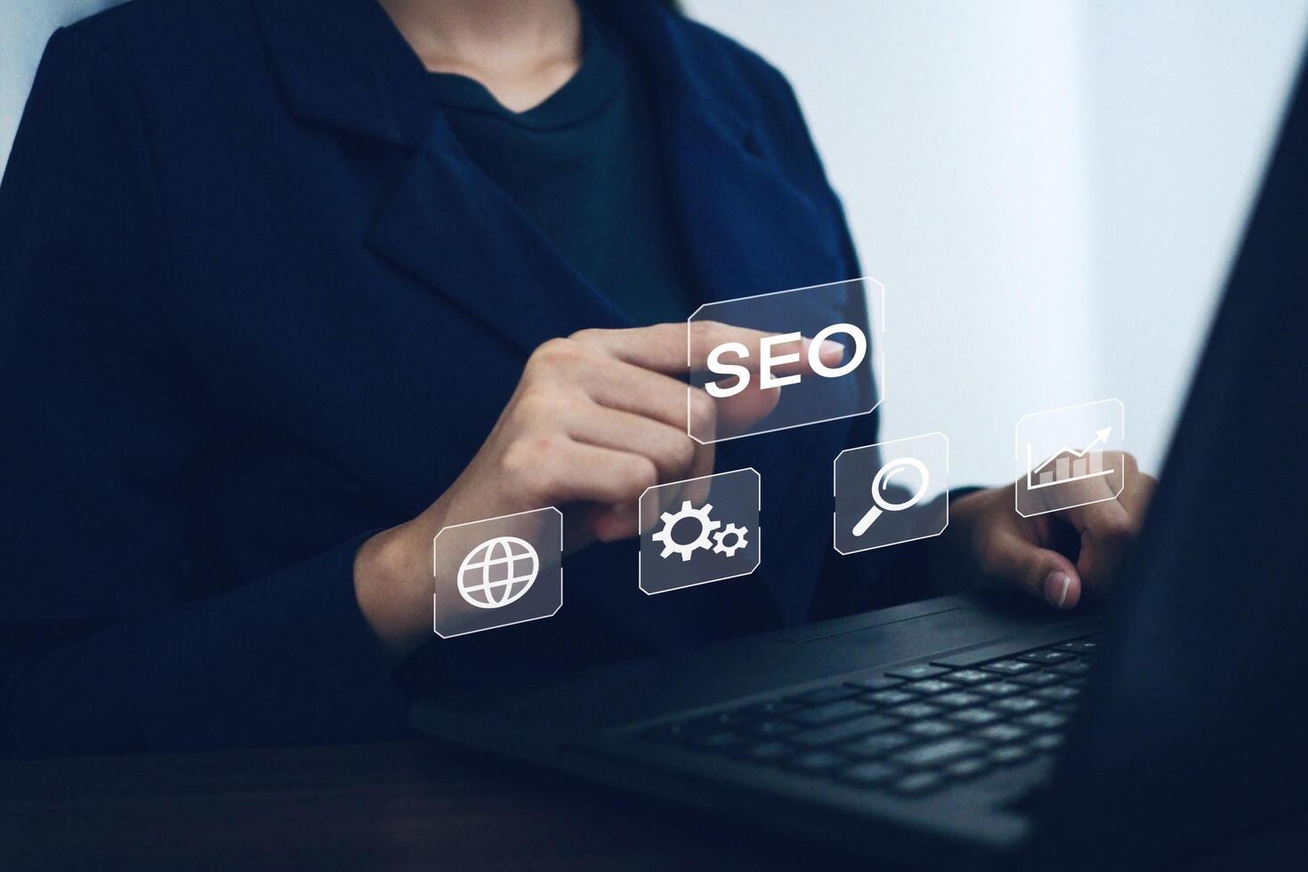 Businesswoman uses notebook computer to optimize SEO and online marketing search concept. photo