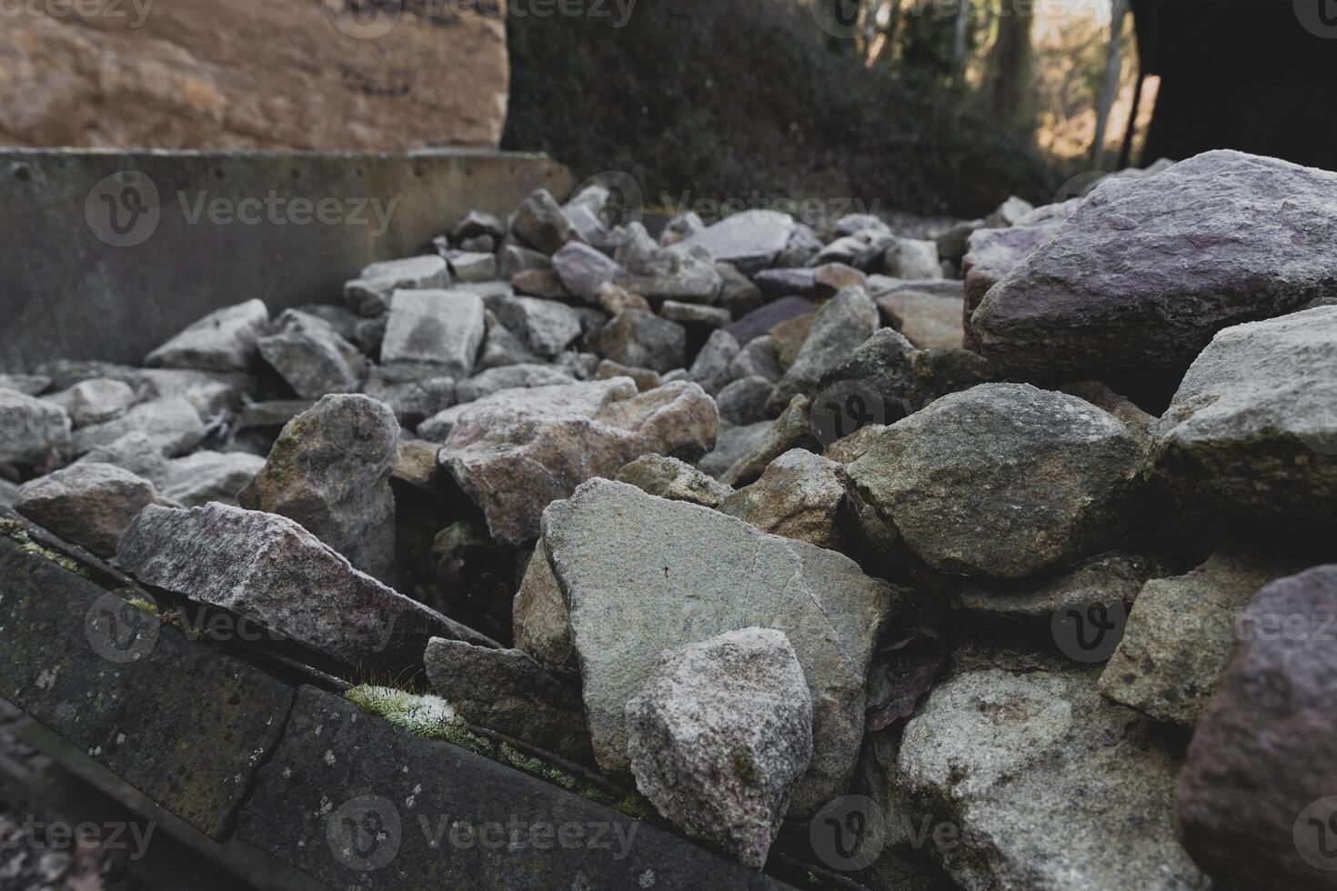 Pile of gravel stones on a construction site in early morning light photo