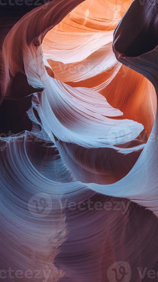 A stunning view of colorful canyon walls with soft curves and vibrant hues of orange and blue. photo