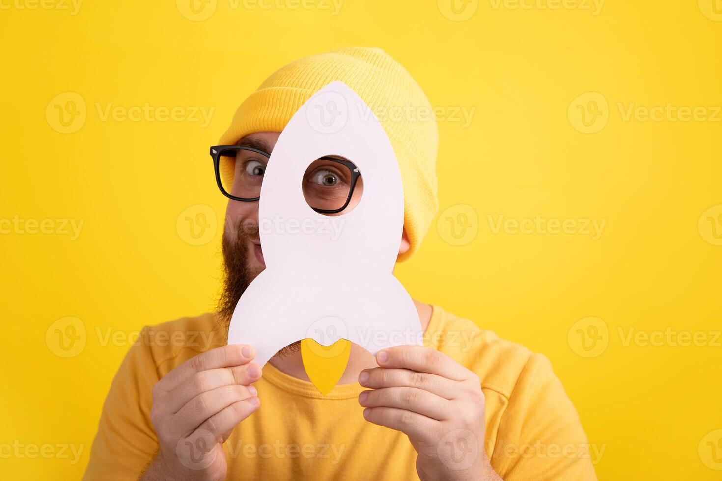 bearded man holding rocket photo