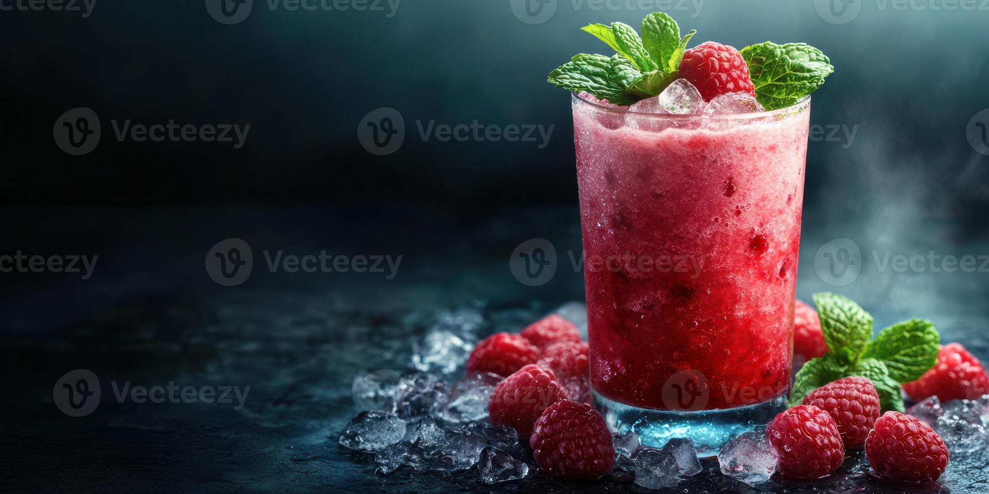 Refreshing raspberry mint drink served on a dark surface with ice and fresh raspberries in the background photo
