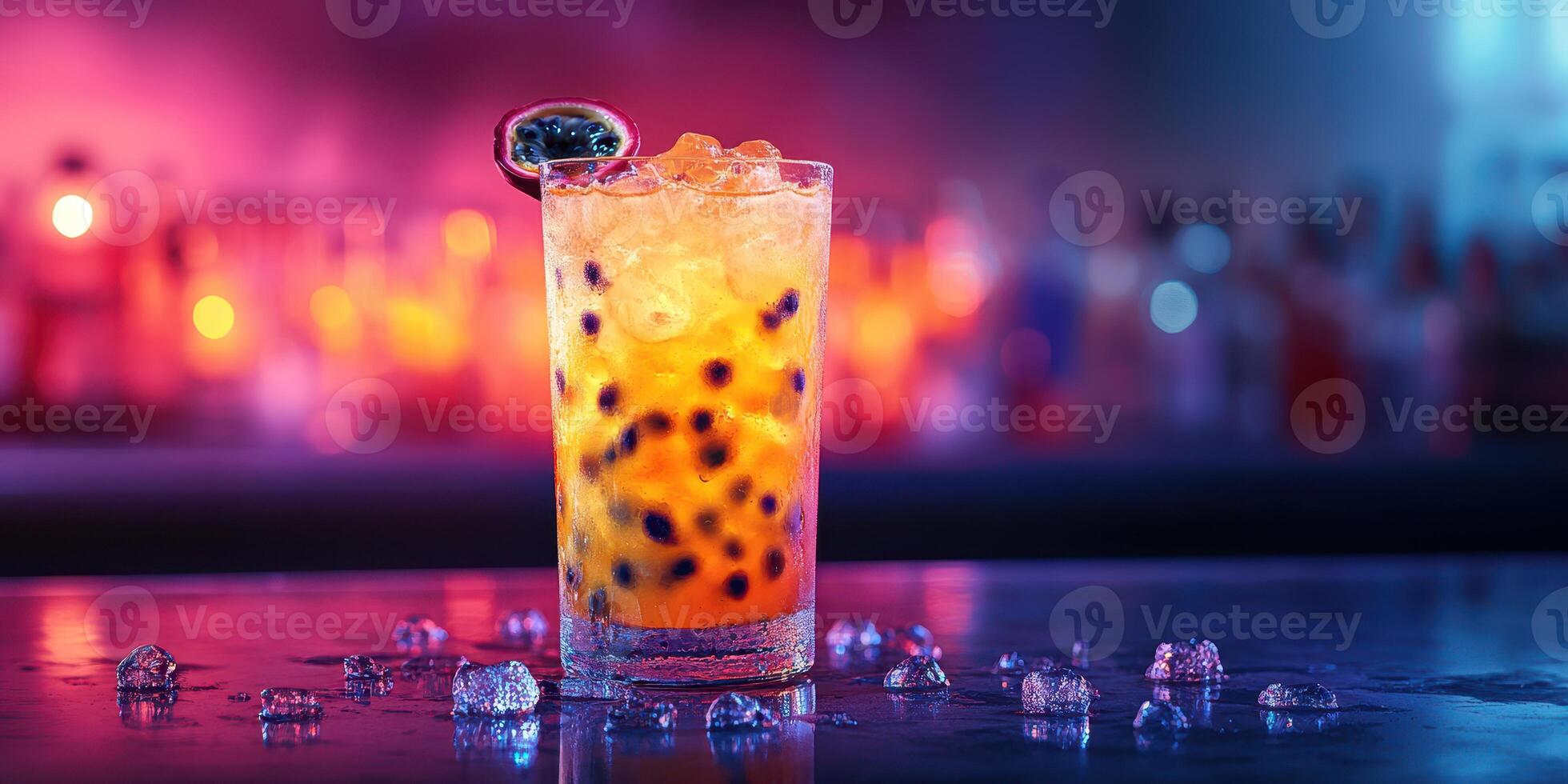 Refreshing tropical cocktail with vibrant colors and ice in a lively bar setting at night photo