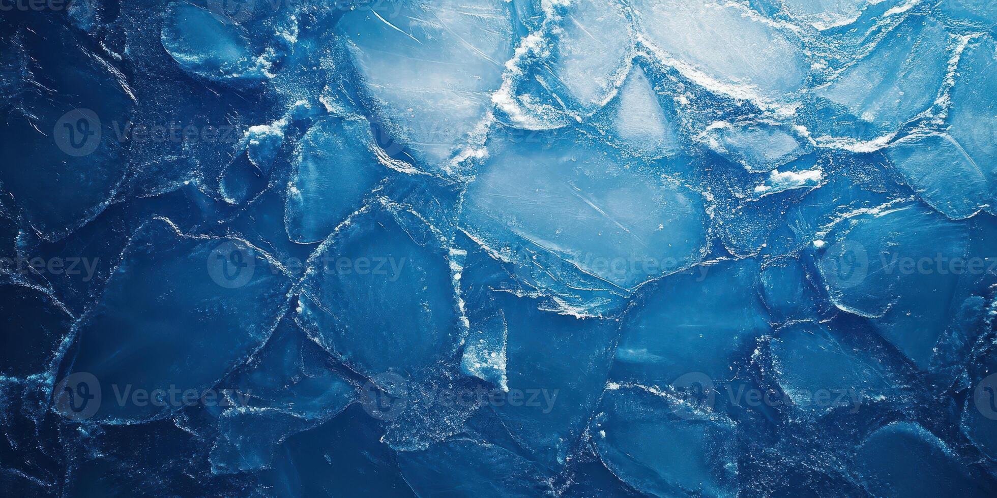 Icebergs floating in a deep blue ocean showcasing stunning natural patterns and textures during a clear day photo