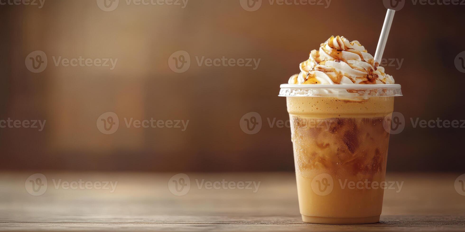 Creamy iced coffee topped with whipped cream and caramel sauce in a cozy cafe setting photo