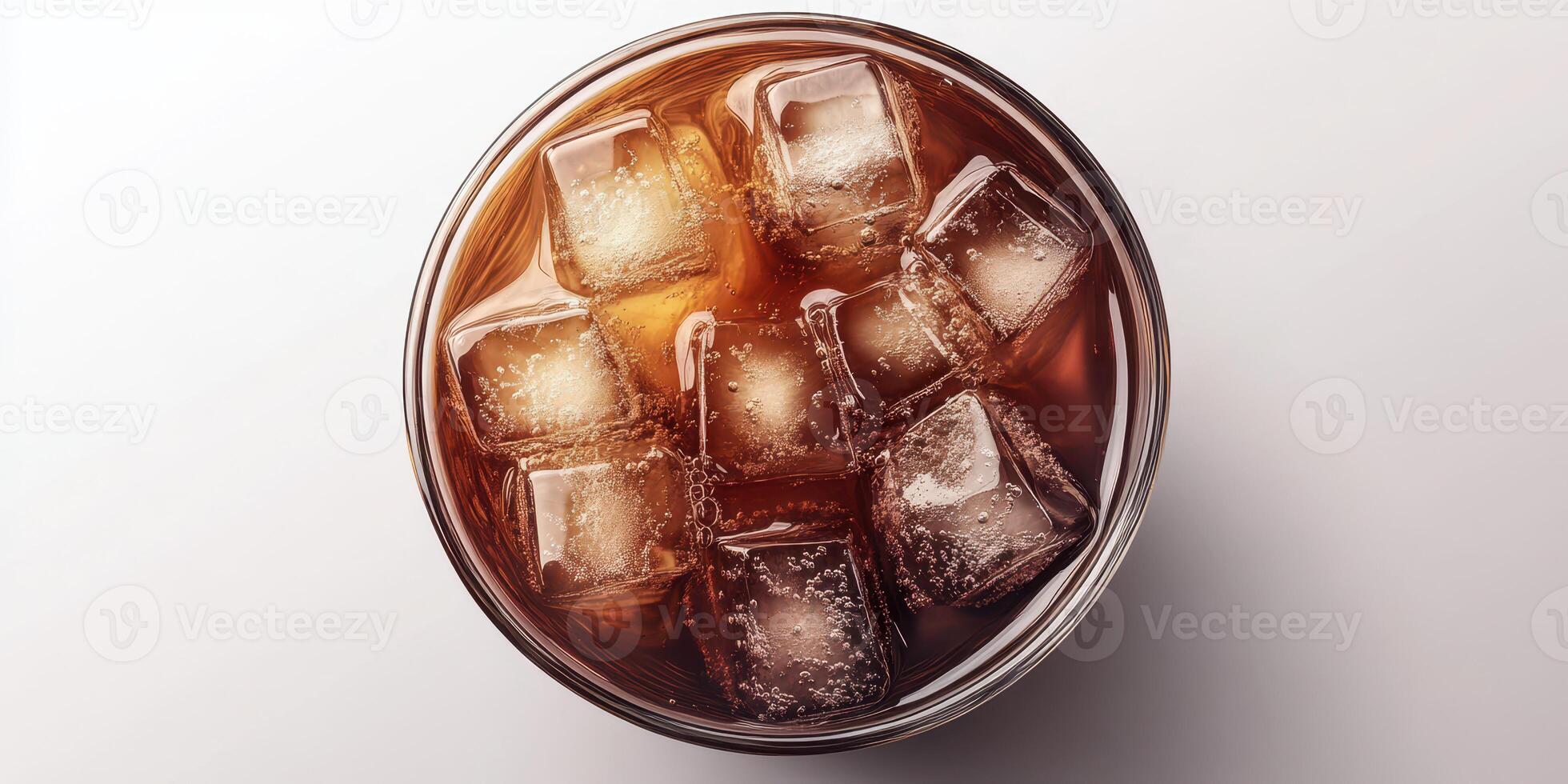 Refreshing cold beverage with ice cubes in a clear glass on a light background during a warm afternoon photo