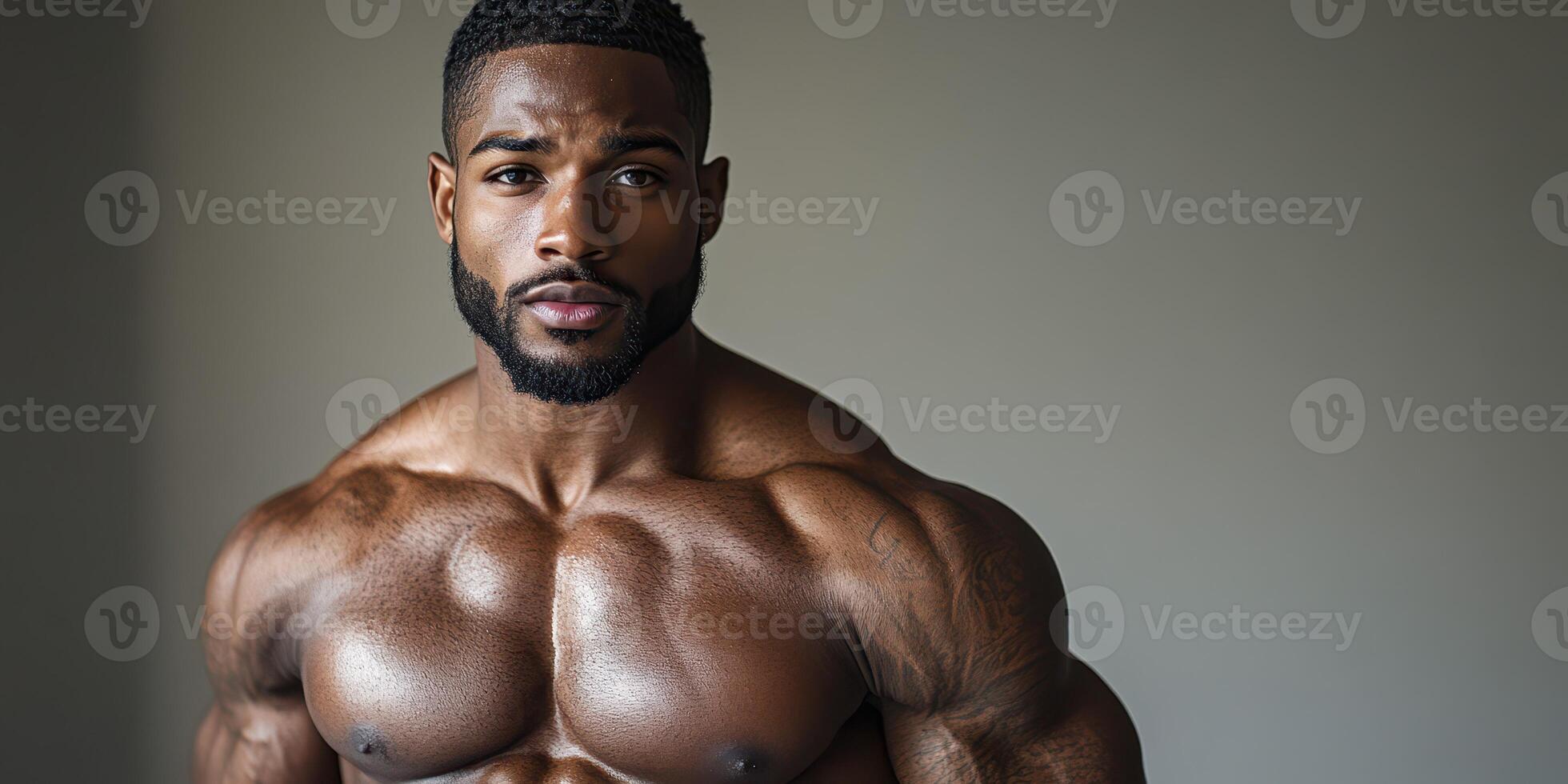 Muscular man showcasing strength and confidence in a bright, minimalistic indoor setting during daylight hours photo