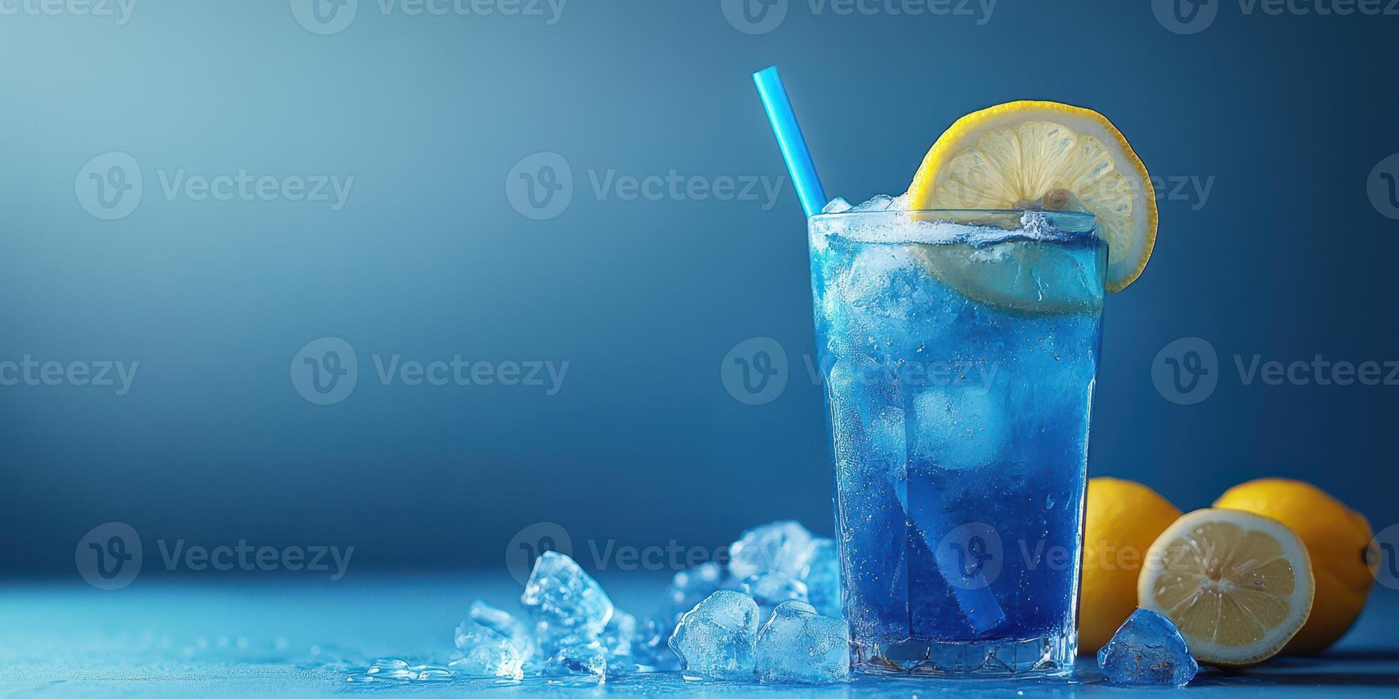 Refreshing blue lemonade served with ice and lemon slices on a blue background in a summer setting photo