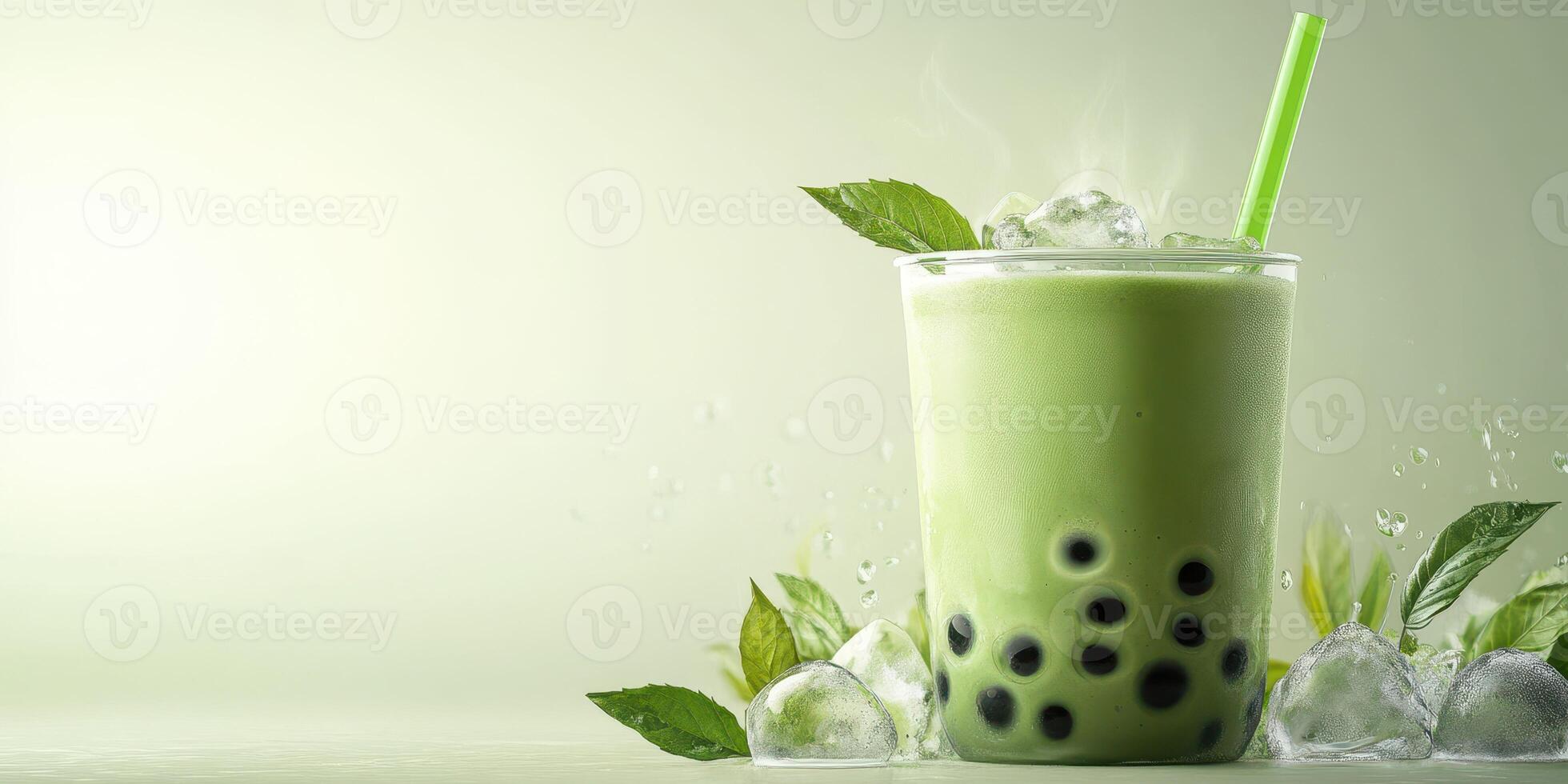 Refreshing green tea bubble drink served with ice and mint leaves on a light background photo